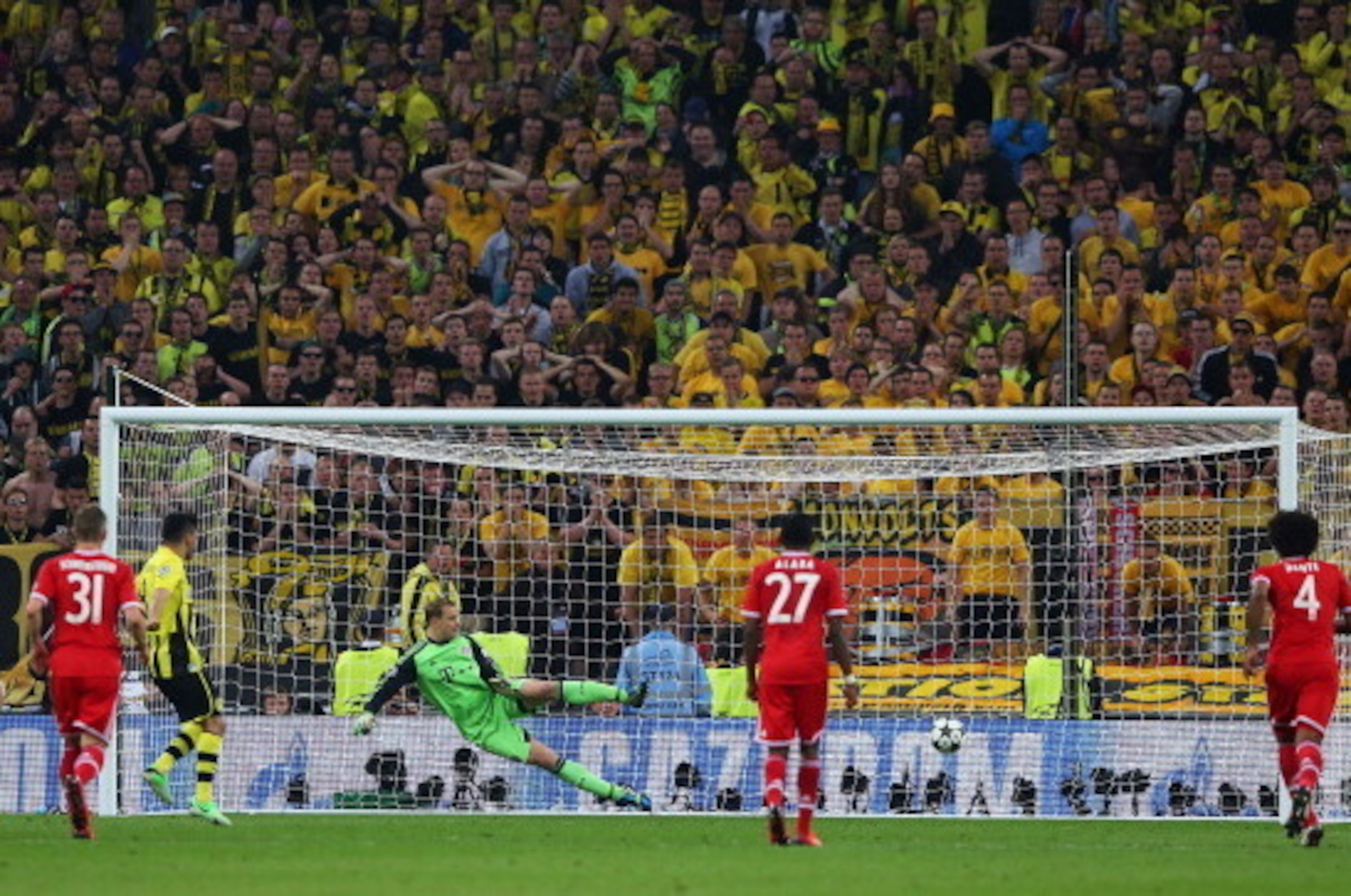 LONDON, ENGLAND - MAY 25: Ilkay Gundogan of Borussia Dortmund scores a goal from the penalty spot past Manuel Neuer of Bayern Muenchen during the UEFA Champions League final match between Borussia Dortmund and FC Bayern Muenchen at Wembley Stadium on May LONDON, ENGLAND - MAY 25: Ilkay Gundogan of Borussia Dortmund scores a goal from the penalty spot past Manuel Neuer of Bayern Muenchen during the UEFA Champions League final match between Borussia Dortmund and FC Bayern Muenchen at Wembley Stadium on May