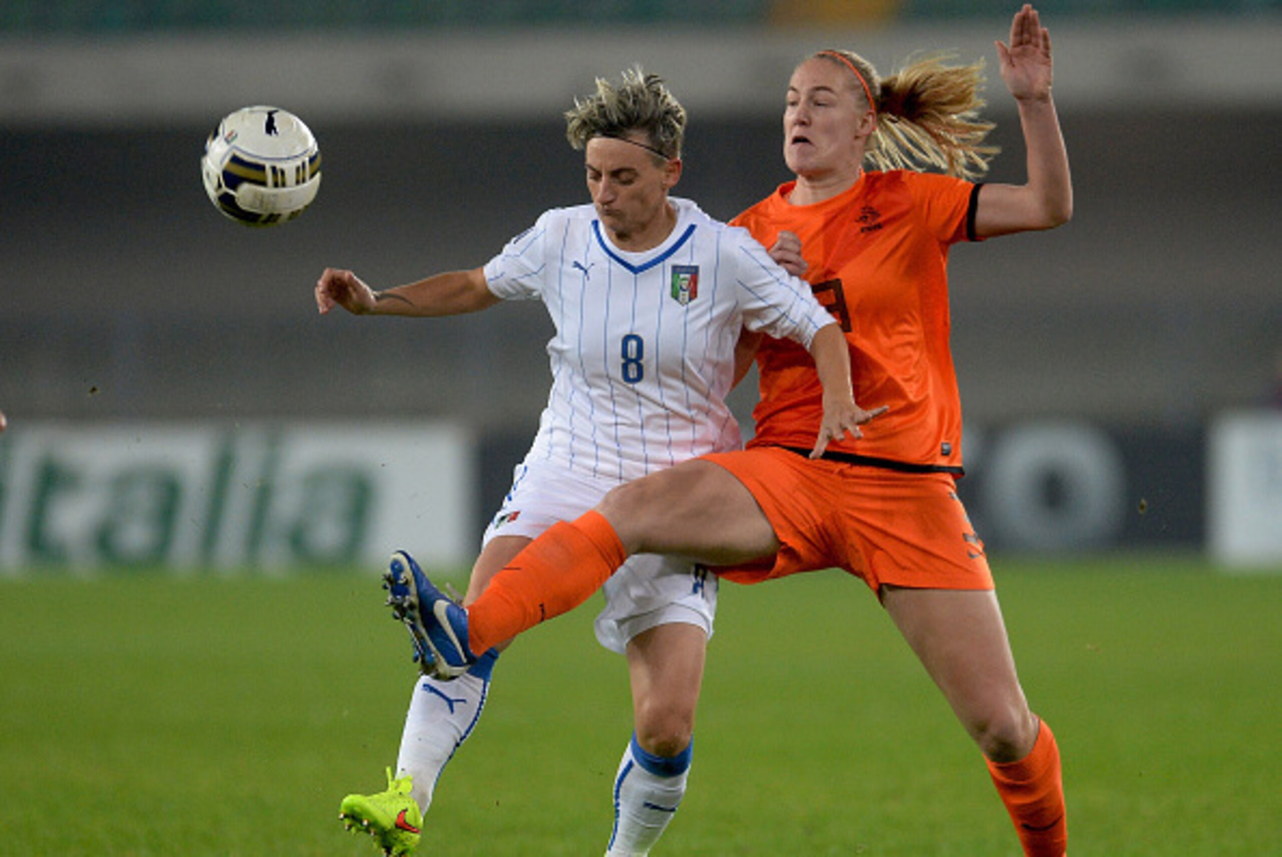 VERONA, ITALY - NOVEMBER 27: Melania Gabbiadini (L) of Italy compertes with Vivianne Miedema Netherlands during the FIFA Women's World Cup Qualifier match between Italy and Netherlands at Stadio Marc'Antonio Bentegodi on November 27, 2014 in Verona, Ital VERONA, ITALY - NOVEMBER 27: Melania Gabbiadini (L) of Italy compertes with Vivianne Miedema Netherlands during the FIFA Women's World Cup Qualifier match between Italy and Netherlands at Stadio Marc'Antonio Bentegodi on November 27, 2014 in Verona, Ital