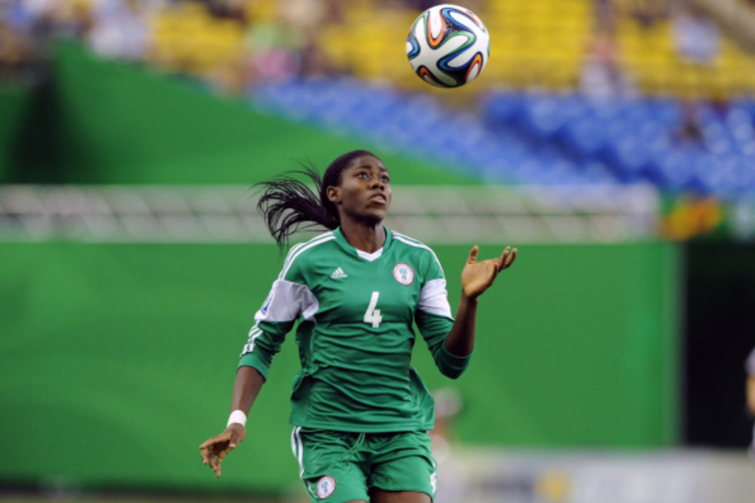 MONTREAL, QC - AUGUST 24: Asisat Oshoala of Nigeria watches the ball descend during the FIFA Women's U-20 Final against Germany at Olympic Stadium on August 24, 2014 in Montreal, Quebec, Canada. Photo by Richard Wolowicz/Getty Images) MONTREAL, QC - AUGUST 24: Asisat Oshoala of Nigeria watches the ball descend during the FIFA Women's U-20 Final against Germany at Olympic Stadium on August 24, 2014 in Montreal, Quebec, Canada. Photo by Richard Wolowicz/Getty Images)