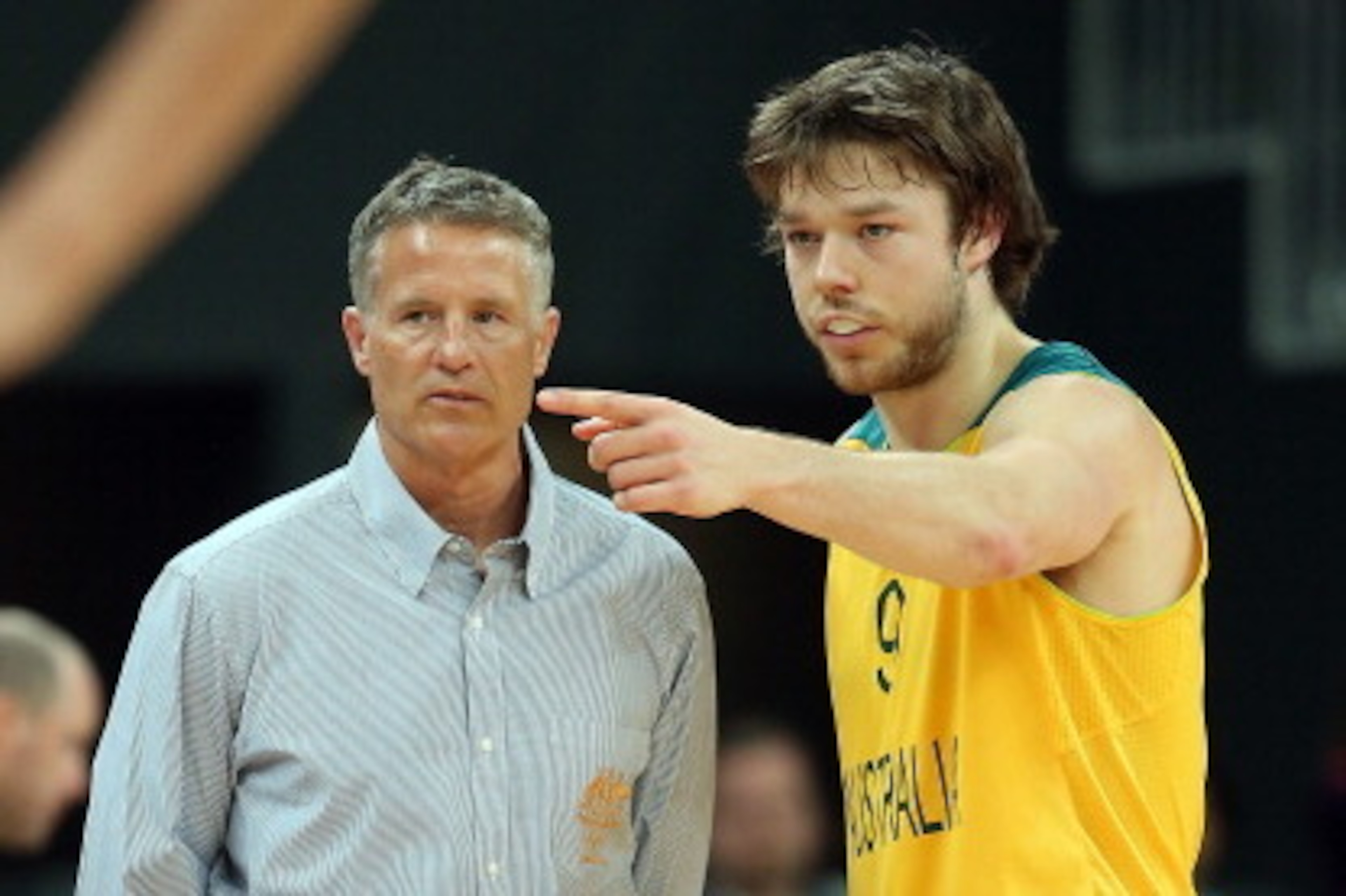 LONDON, ENGLAND - AUGUST 02:  Brett Brown (L), head coach for Australia, talks with Matt Dellavedova  #9 of Australia in the first half of the game against China during the Men's Basketball Preliminary Round match on Day 6 of the London 2012 Olympic Games