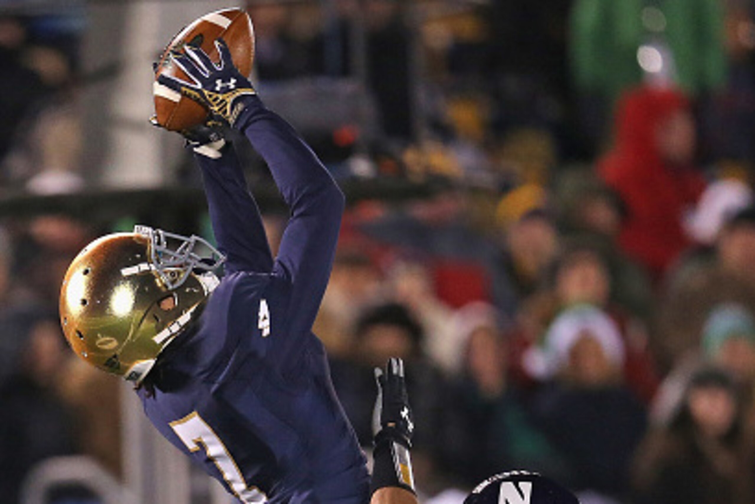 SOUTH BEND, IN - NOVEMBER 15:  Will Fuller #7 of the Notre Dame Fighting Irish makes a 42 yard reception over Nick VanHoose #23 of the Northwestern Wildcats at Notre Dame Stadium on November 15, 2014 in South Bend, Indiana. Northwestern defeated Notre Dam