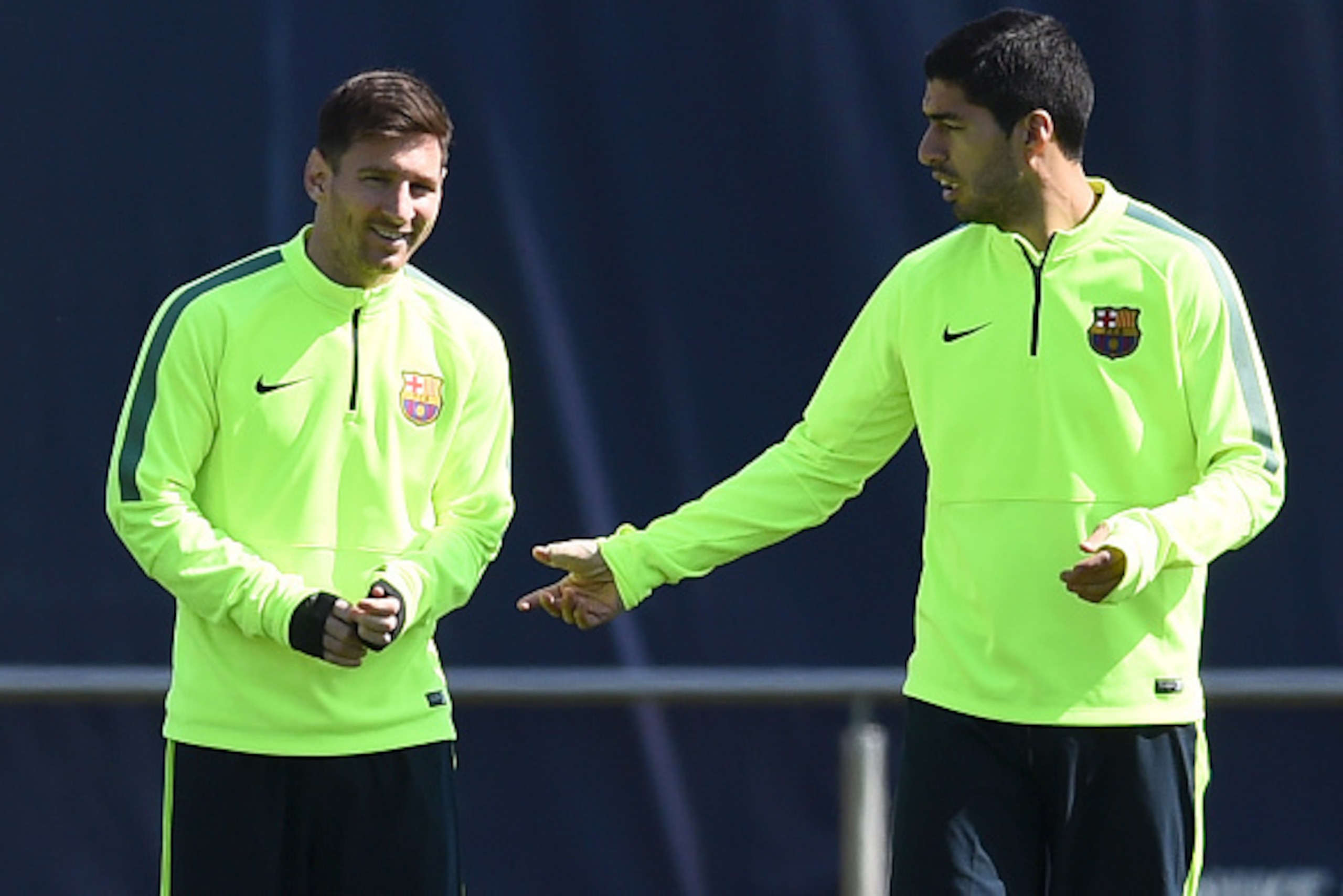 BARCELONA, SPAIN - MARCH 17: Lionel Messi (L) of FC Barcelona chats with his teammate Luis Suarez of FC Barcelona warms up during a training session ahead of theid UEFA Champions League round of 16 match against Manchester City at Ciutat Esportiva on Mar BARCELONA, SPAIN - MARCH 17: Lionel Messi (L) of FC Barcelona chats with his teammate Luis Suarez of FC Barcelona warms up during a training session ahead of theid UEFA Champions League round of 16 match against Manchester City at Ciutat Esportiva on Mar