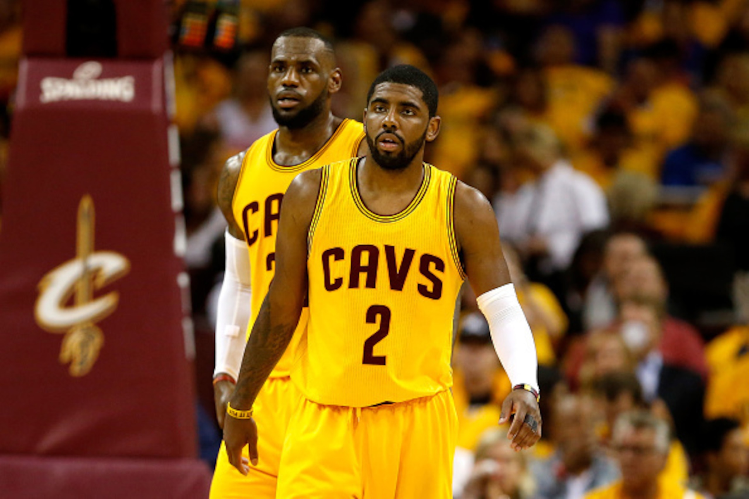 CLEVELAND, OH - MAY 26: LeBron James #23 and Kyrie Irving #2 of the Cleveland Cavaliers look on in the third quarter against the Atlanta Hawks during Game Four of the Eastern Conference Finals of the 2015 NBA Playoffs at Quicken Loans Arena on May 26, 201