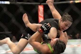 Jan 31, 2015; Las Vegas, NV, USA;  Sara McMann (blue gloves) elbows Miesha Tate (red gloves) during their women's bantamweight bout during UFC 183 at the MGM Grand Garden Arena. Mandatory Credit: Jayne Kamin-Oncea-USA TODAY Sports