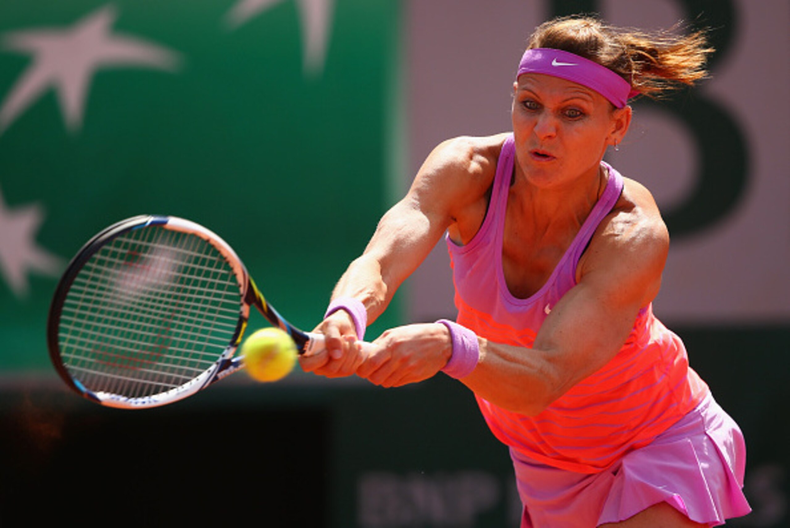 PARIS, FRANCE - JUNE 02:  Lucie Safarova of Czech Repbulic plays a backhand in her Women's quarter final match against Garbine Muguruza of Spain on day of the 2015 French Open at Roland Garros on June 2, 2015 in Paris, France.  (Photo by Clive Brunskill/G