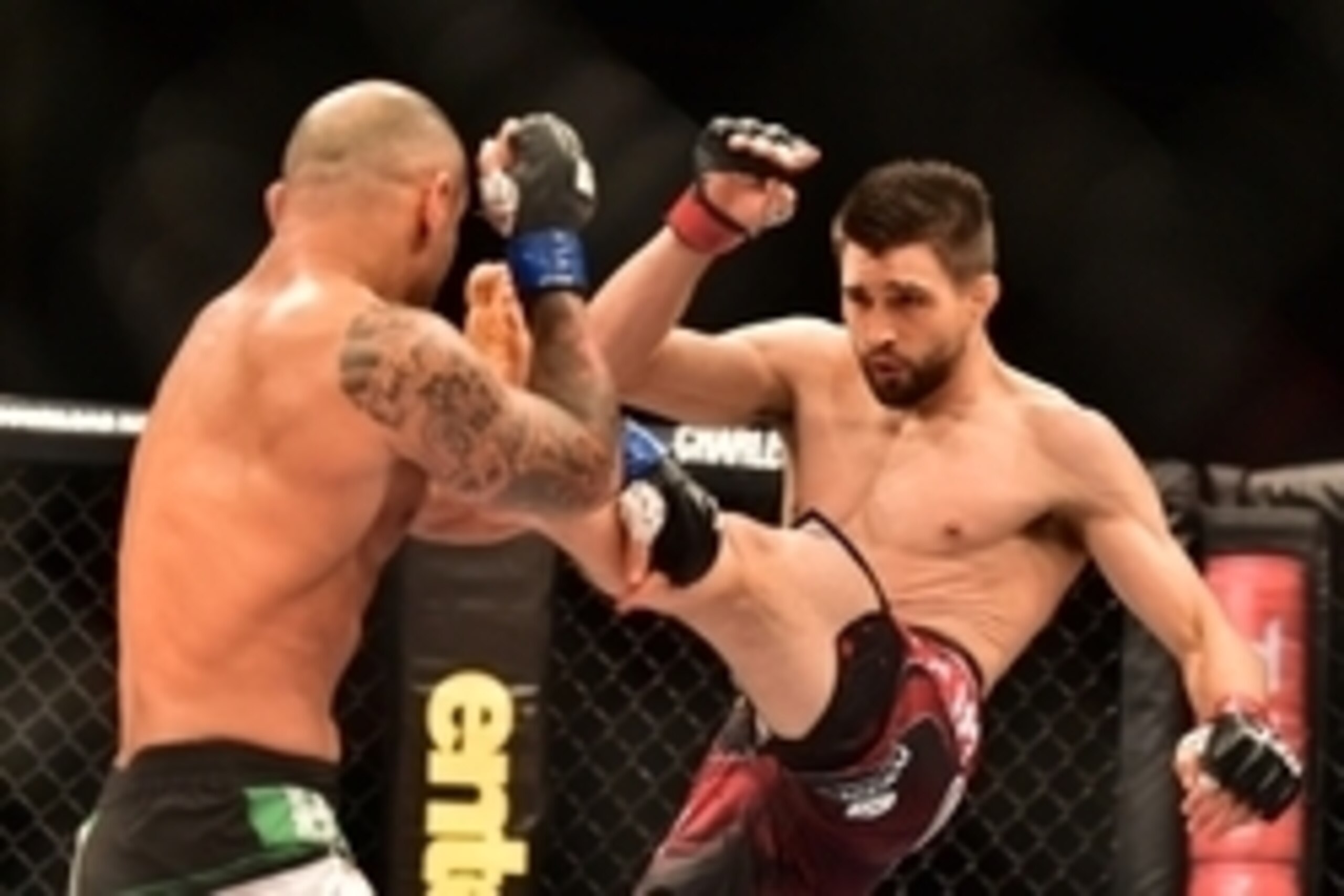 May 30, 2015; Goiania, GO, Brazil; Carlos Condit (red gloves) fights Thiago Alves (blue gloves) during UFC Fight Night at Goiania Arena. Mandatory Credit: Jason Silva-USA TODAY Sports