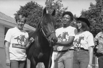 Mickey Taylor, left, and Karen Taylor, owners of Seattle Slew, stand by their horse with at the Belmont Park stables.