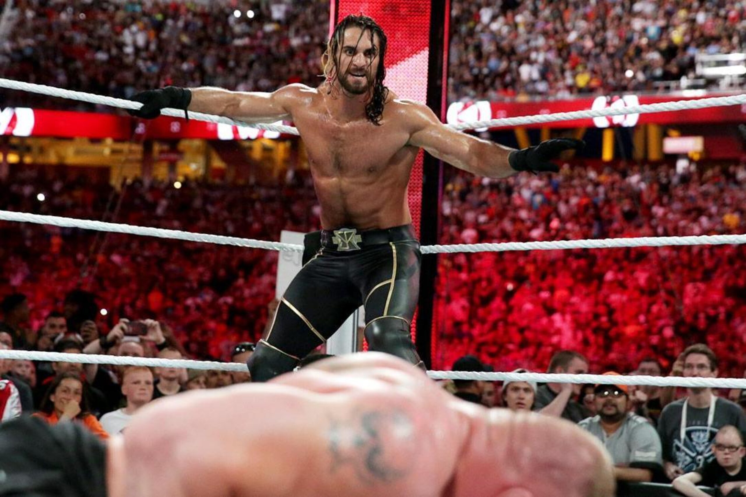 Seth Rollins lines up Brock Lesnar for a Curb Stomp.