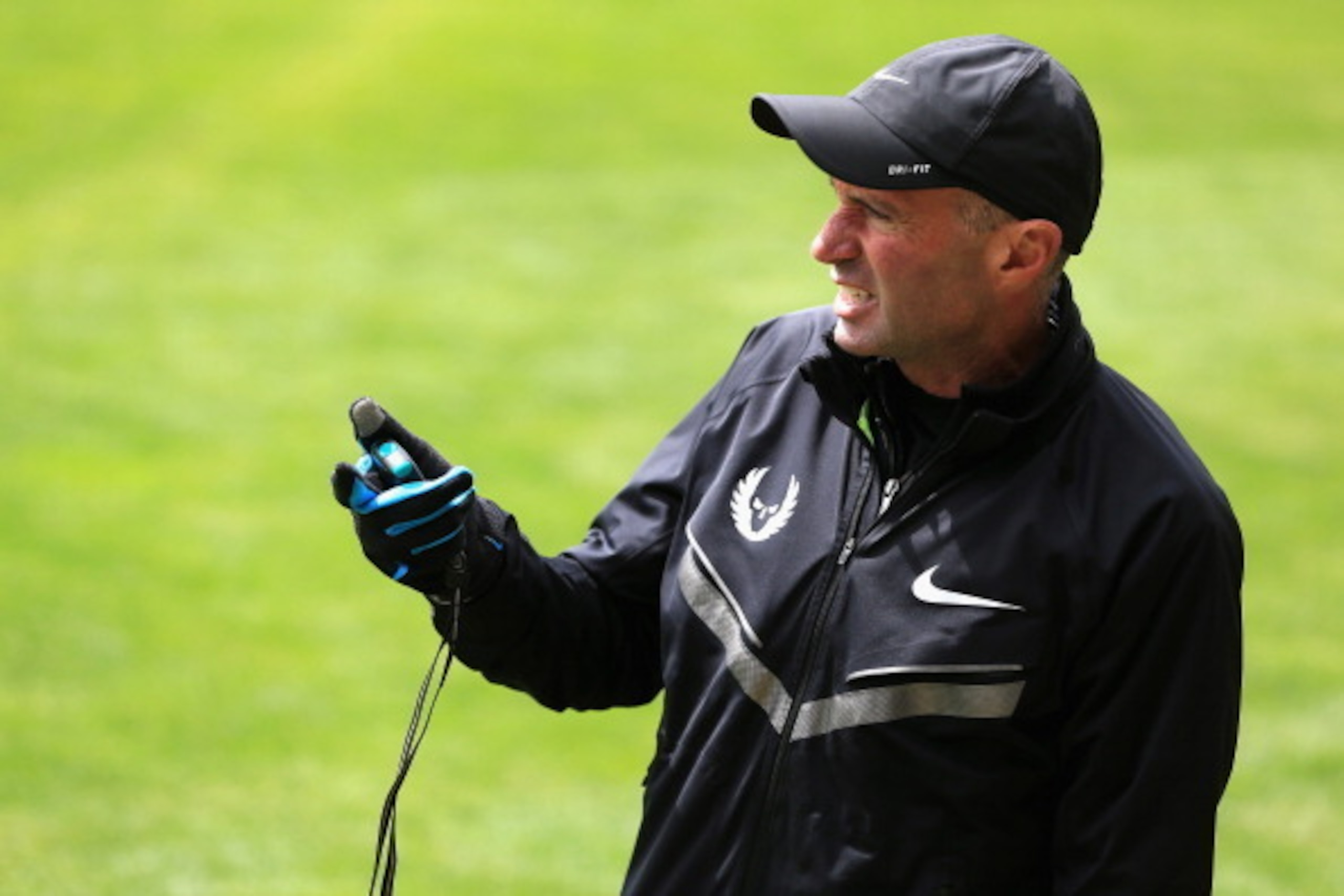 BEAVERTON, OR - APRIL 13:  Coach Alberto Salazar of the Nike Oregon Project times athletes as they train on the grass at the Nike campus on April 13, 2013 in Beaverton, Oregon.  (Photo by Doug Pensinger/Getty Images)