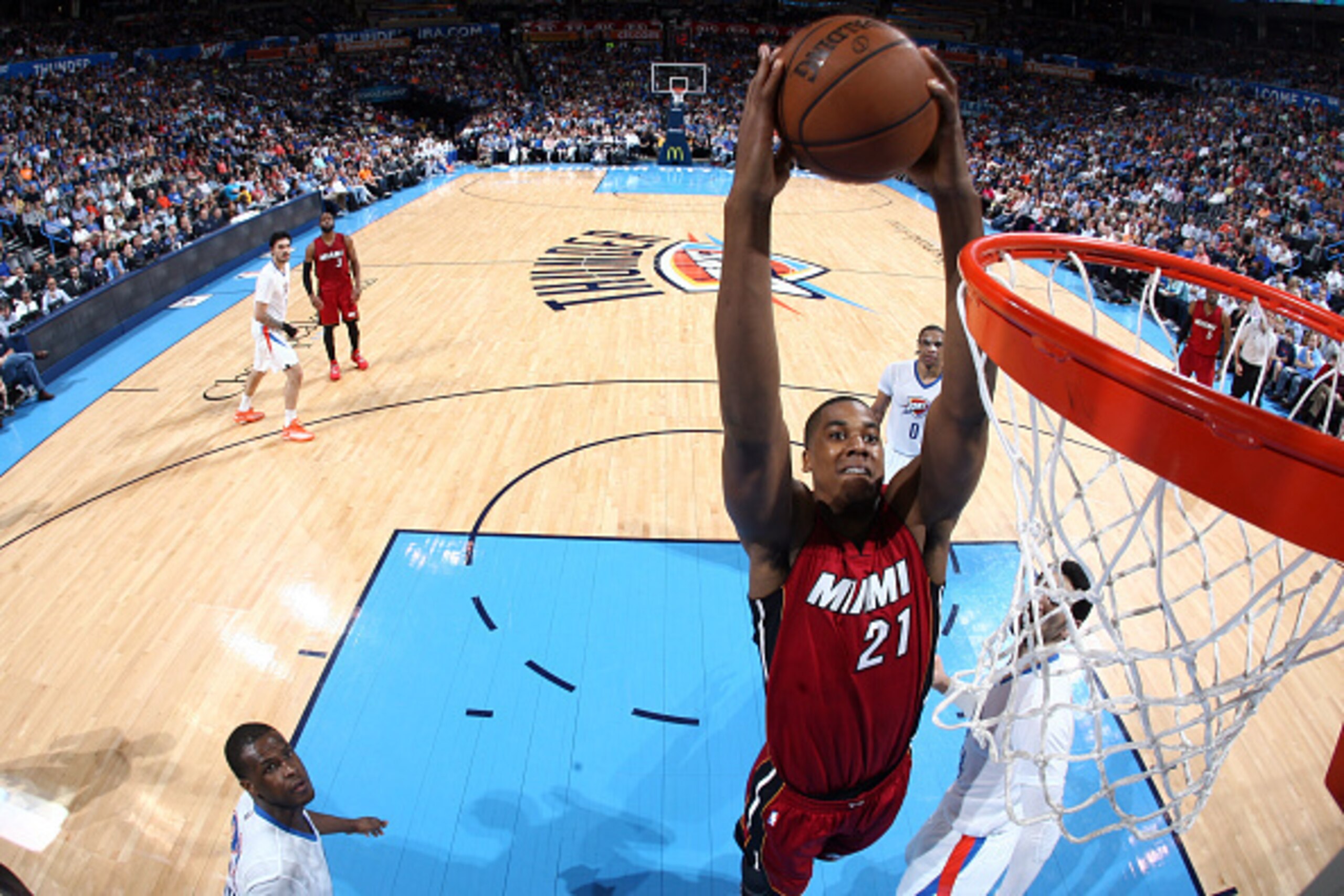OKLAHOMA CITY, OK- March 22: Hassan Whiteside #21 of the Miami Heat dunks against the Oklahoma City Thunder on March 22, 2015 at Chesapeake Energy Arena in Oklahoma City, Oklahoma. NOTE TO USER: User expressly acknowledges and agrees that, by downloading