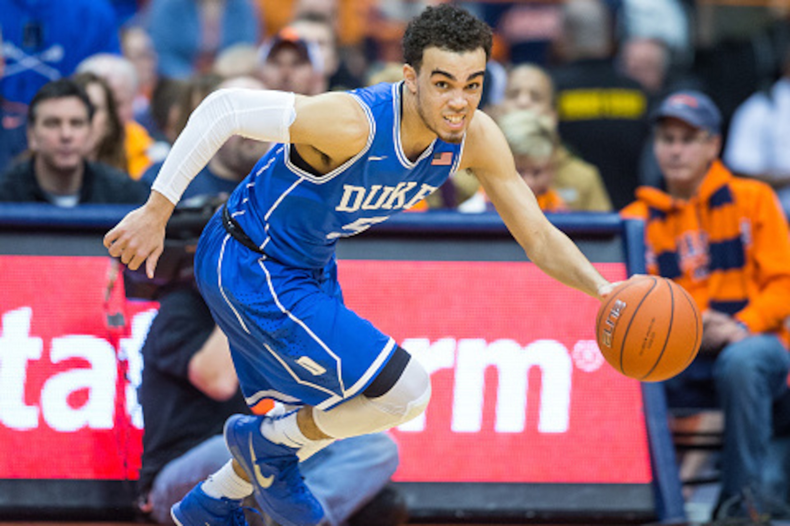 SYRACUSE, NY - FEBRUARY 14:  Tyus Jones #5 of the Duke Blue Devils dribbles up court during the second half against the Syracuse Orange on February 14, 2015 at The Carrier Dome in Syracuse, New York.  Duke defeats Syracuse 80-72.  (Photo by Brett Carlsen/