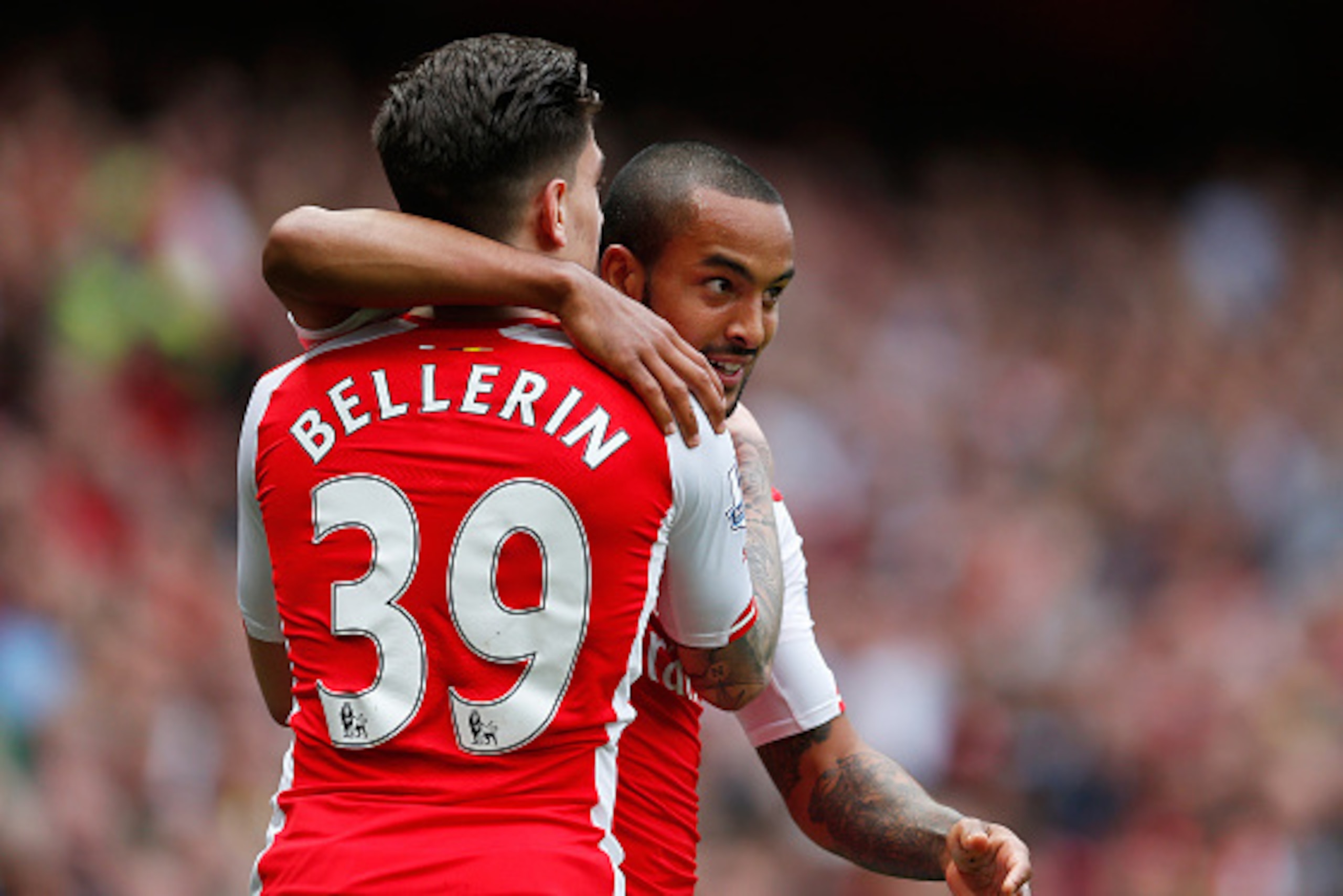 LONDON, ENGLAND - MAY 24:  Theo Walcott (R) of Arsenal celebrates scoring his team's second goal with his team mate Hector Bellerin (L) during the Barclays Premier League match between Arsenal and West Bromwich Albion at Emirates Stadium on May 24, 2015 i