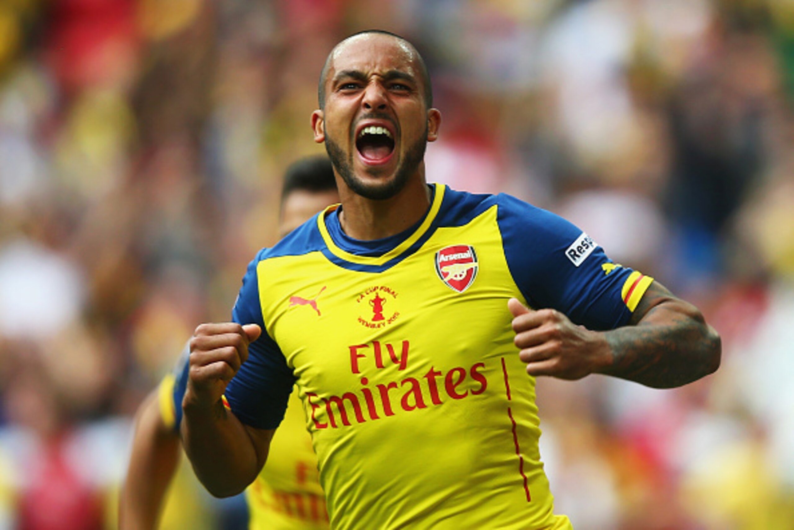 LONDON, ENGLAND - MAY 30:  Theo Walcott of Arsenal celebrates as he scores their first goal during the FA Cup Final between Aston Villa and Arsenal at Wembley Stadium on May 30, 2015 in London, England.  (Photo by Clive Rose/Getty Images)