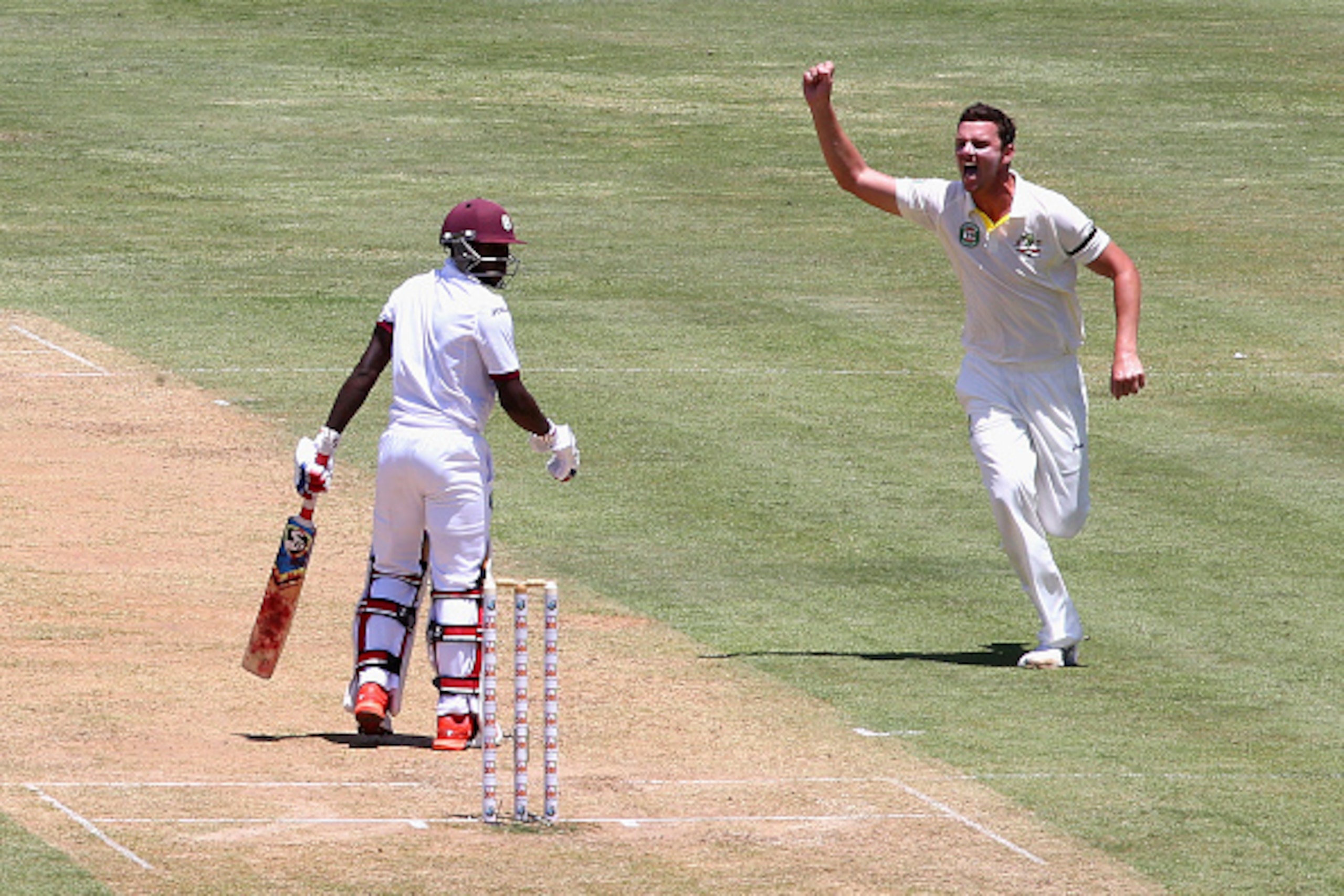 ROSEAU, DOMINICA - JUNE 03:  Josh Hazlewood of Australia celebrates after taking the wicket of Jermaine Blackwood of West Indies during day one of the First Test match between Australia and the West Indies at Windsor Park on June 3, 2015 in Roseau, Domini