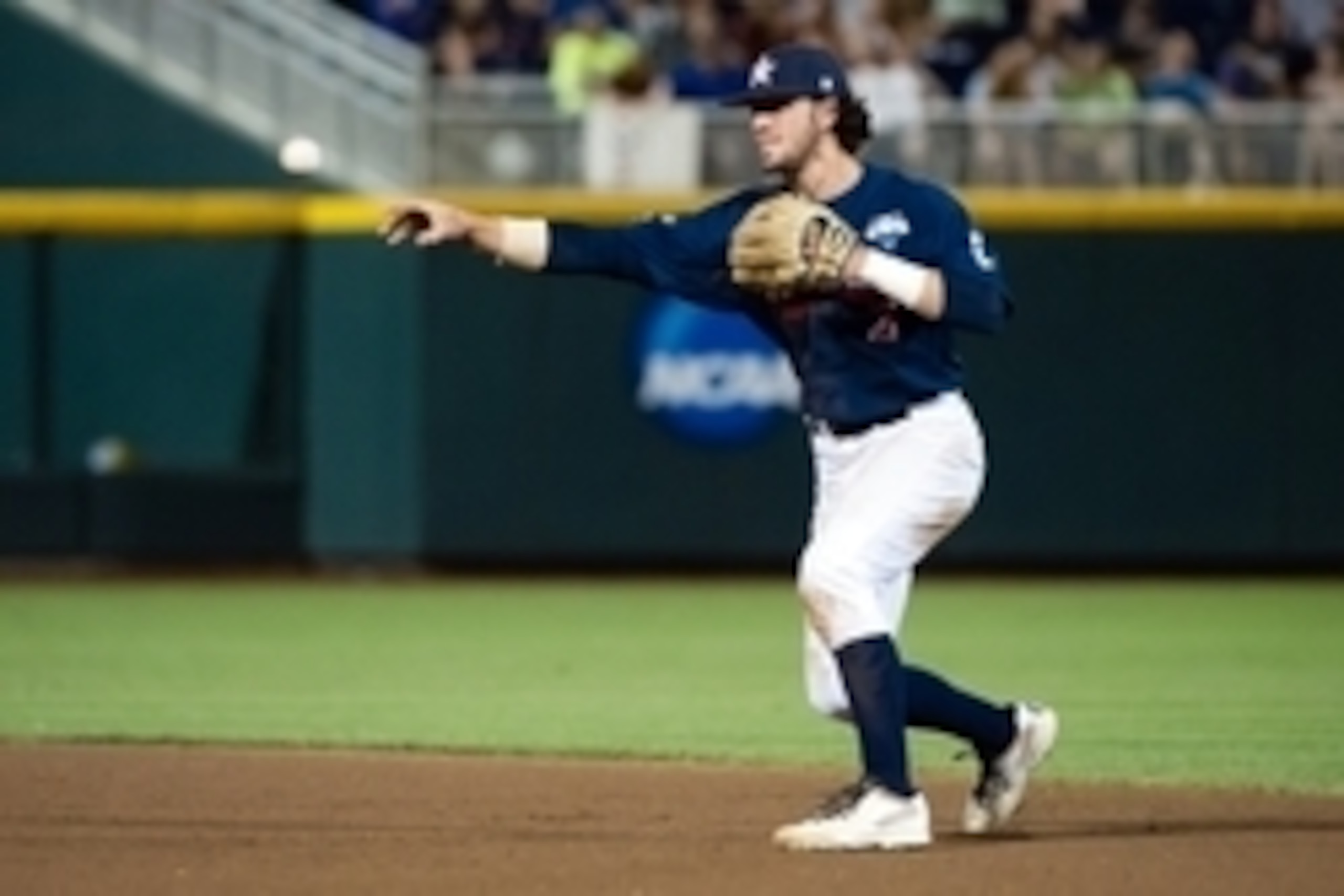 Jun 23, 2014; Omaha, NE, USA; Vanderbilt Commodores infielder Dansby Swanson (7) makes the throw to first base against the Virginia Cavaliers during game one of the College World Series Finals at TD Ameritrade Park Omaha. Vanderbilt defeated Virginia 9-8.
