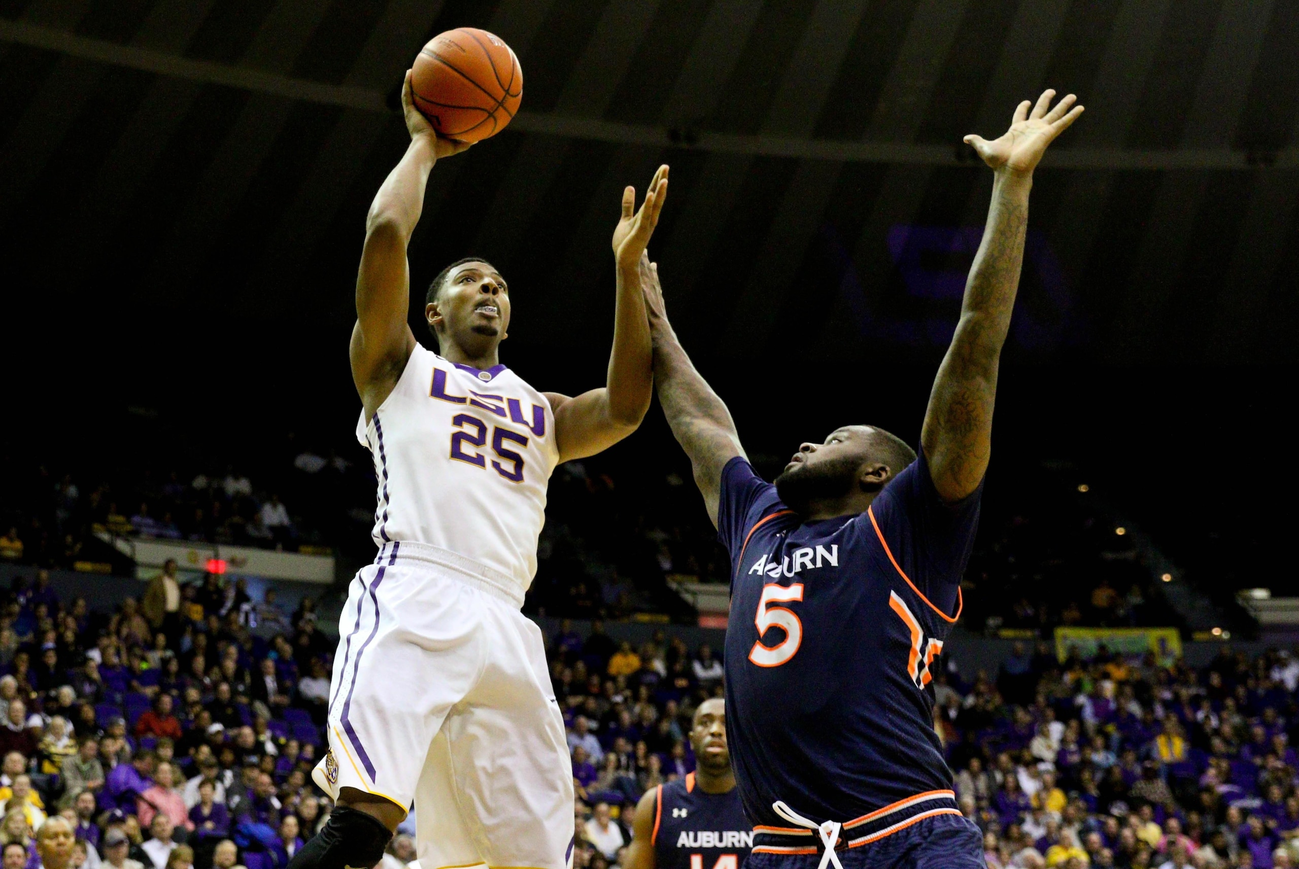 Feb 5, 2015; Baton Rouge, LA, USA; LSU Tigers forward Jordan Mickey (25) shoots over Auburn Tigers forward Cinmeon Bowers (5) during the second half of a game at the Pete Maravich Assembly Center. Auburn defeated LSU 81-77. Mandatory Credit: Derick E. Hin