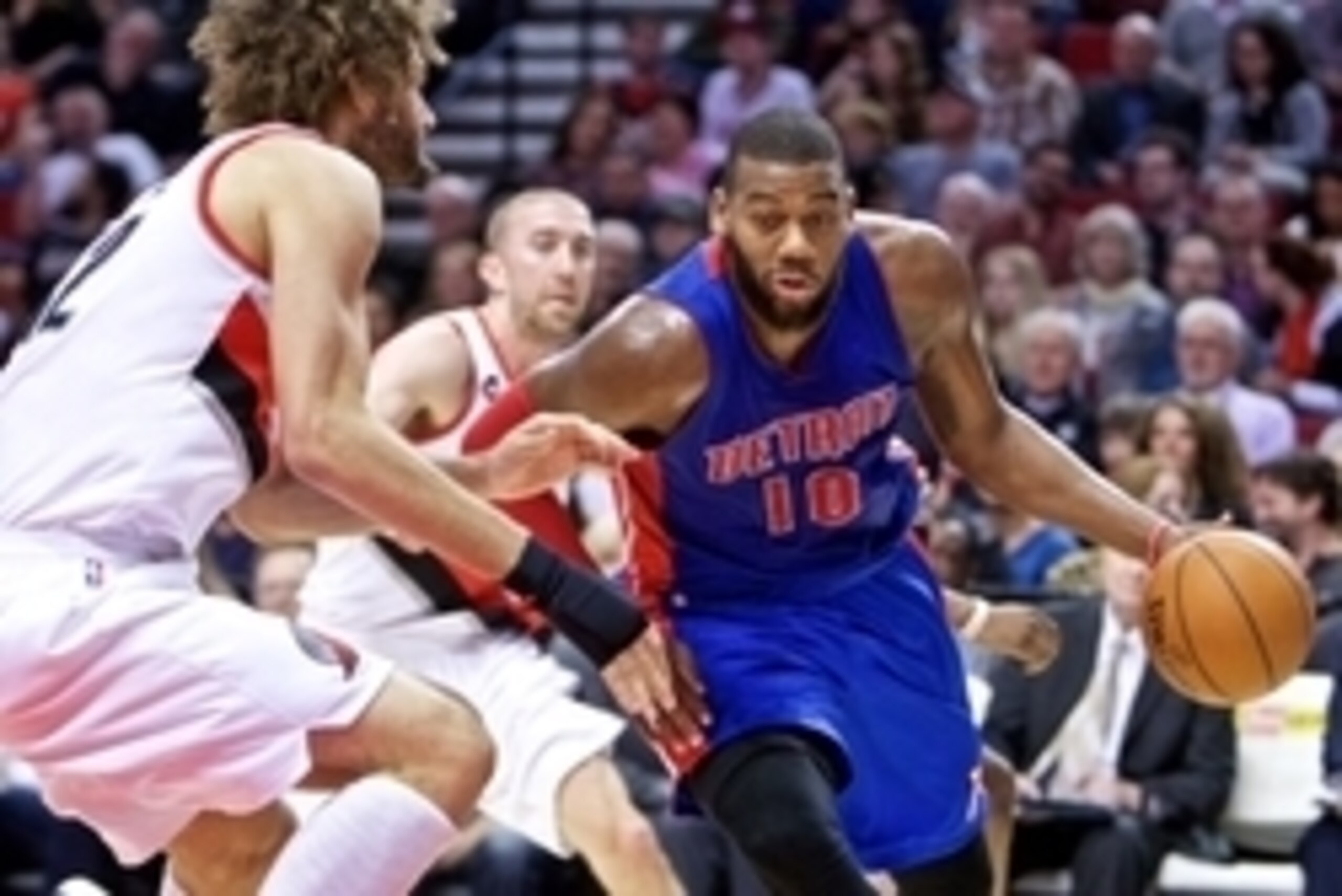 Mar 13, 2015; Portland, OR, USA; Detroit Pistons forward Greg Monroe (10) drives past Portland Trail Blazers center Robin Lopez (42) during the second quarter at the Moda Center. Mandatory Credit: Craig Mitchelldyer-USA TODAY Sports
