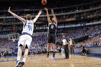 DALLAS, TX - MAY 2: Tony Parker #9 of the San Antonio Spurs shoots a jumper against Dirk Nowitzki #41 of the Dallas Mavericks in Game Six of the Western Conference Quarterfinals during the 2014 NBA Playoffs on May 2, 2014 at the American Airlines Center i