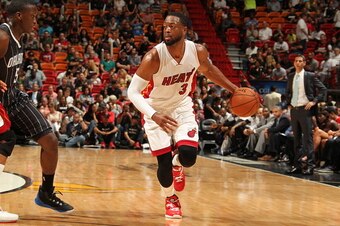 MIAMI, FL - APRIL 13:  Dwyane Wade #3 of the Miami Heat brings the ball up court against against the Orlando Magic on April 13, 2015 at American Airlines Arena in Miami, Florida.  NOTE TO USER: User expressly acknowledges and agrees that, by downloading a