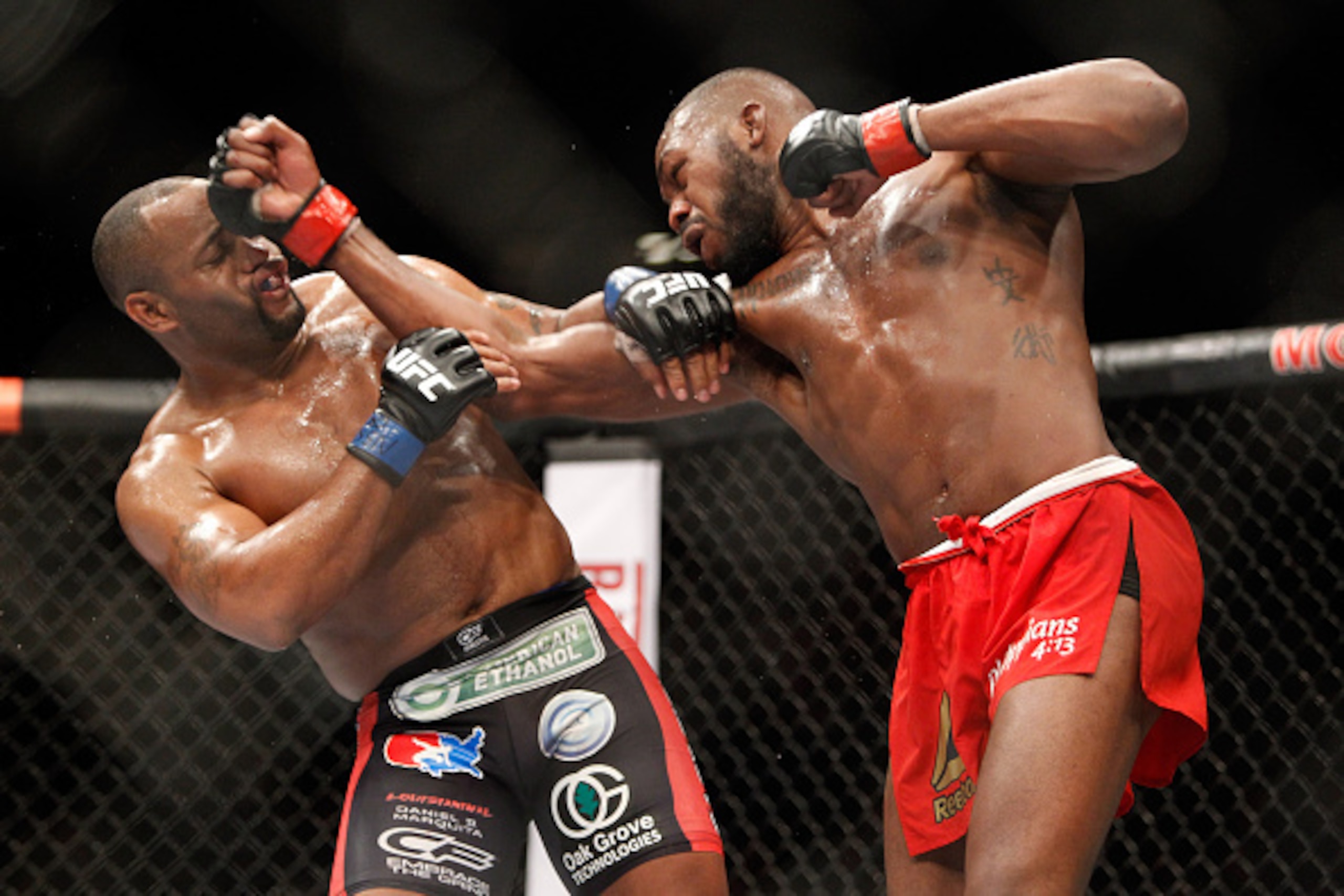 LAS VEGAS, NV - JANUARY 03:  Light heavyweight champion Jon Jones (R) punches Daniel Comier during the UFC 182 event at the MGM Grand Garden Arena on January 3, 2015 in Las Vegas, Nevada. Jones retained his title by unanimous decision.  (Photo by Steve Ma