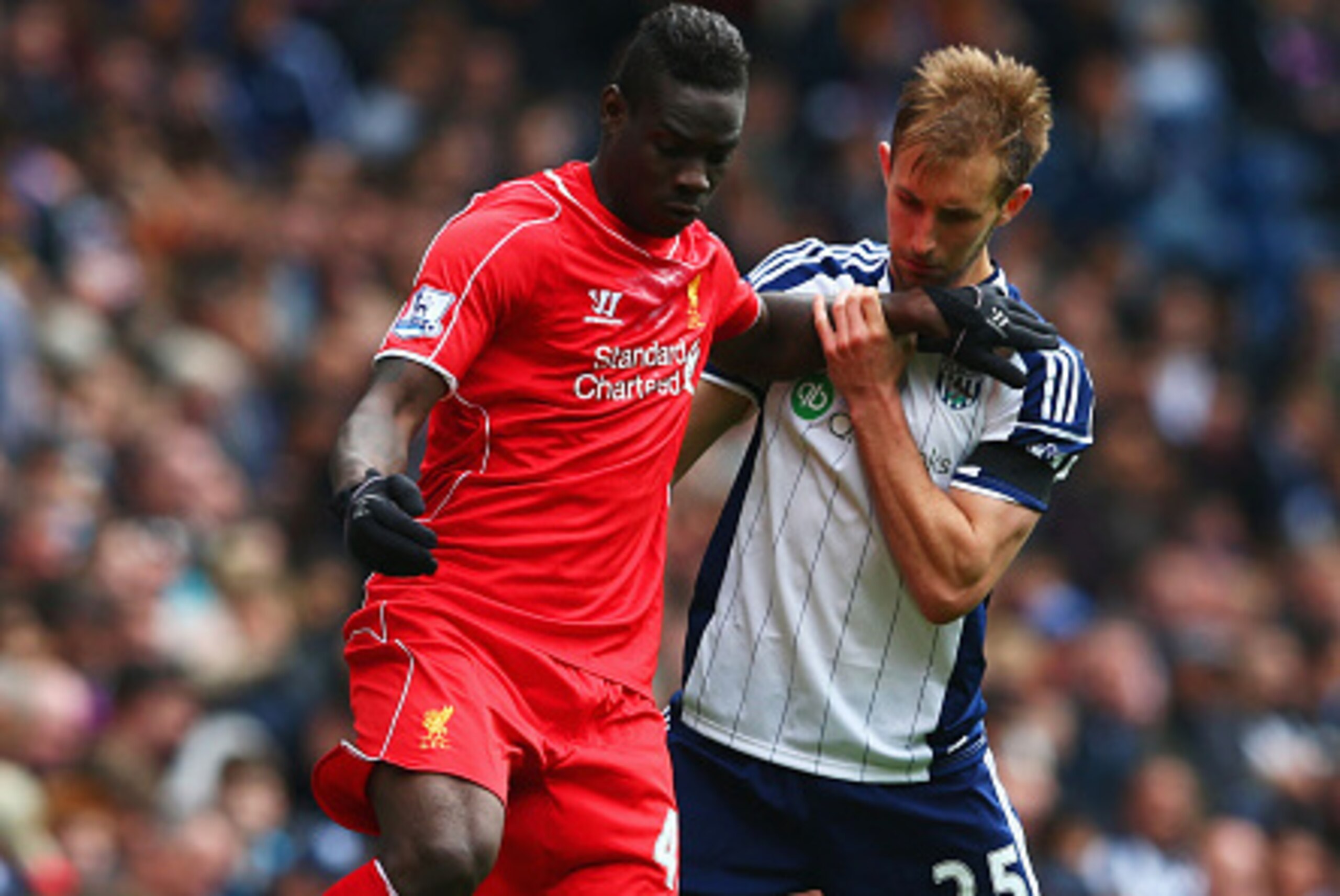 WEST BROMWICH, ENGLAND - APRIL 25: Mario Balotelli of Liverpool and Craig Dawson of West Brom compete for the ball during the Barclays Premier League match between West Bromwich Albion and Liverpool at The Hawthorns on April 25, 2015 in West Bromwich, Eng WEST BROMWICH, ENGLAND - APRIL 25: Mario Balotelli of Liverpool and Craig Dawson of West Brom compete for the ball during the Barclays Premier League match between West Bromwich Albion and Liverpool at The Hawthorns on April 25, 2015 in West Bromwich, Eng