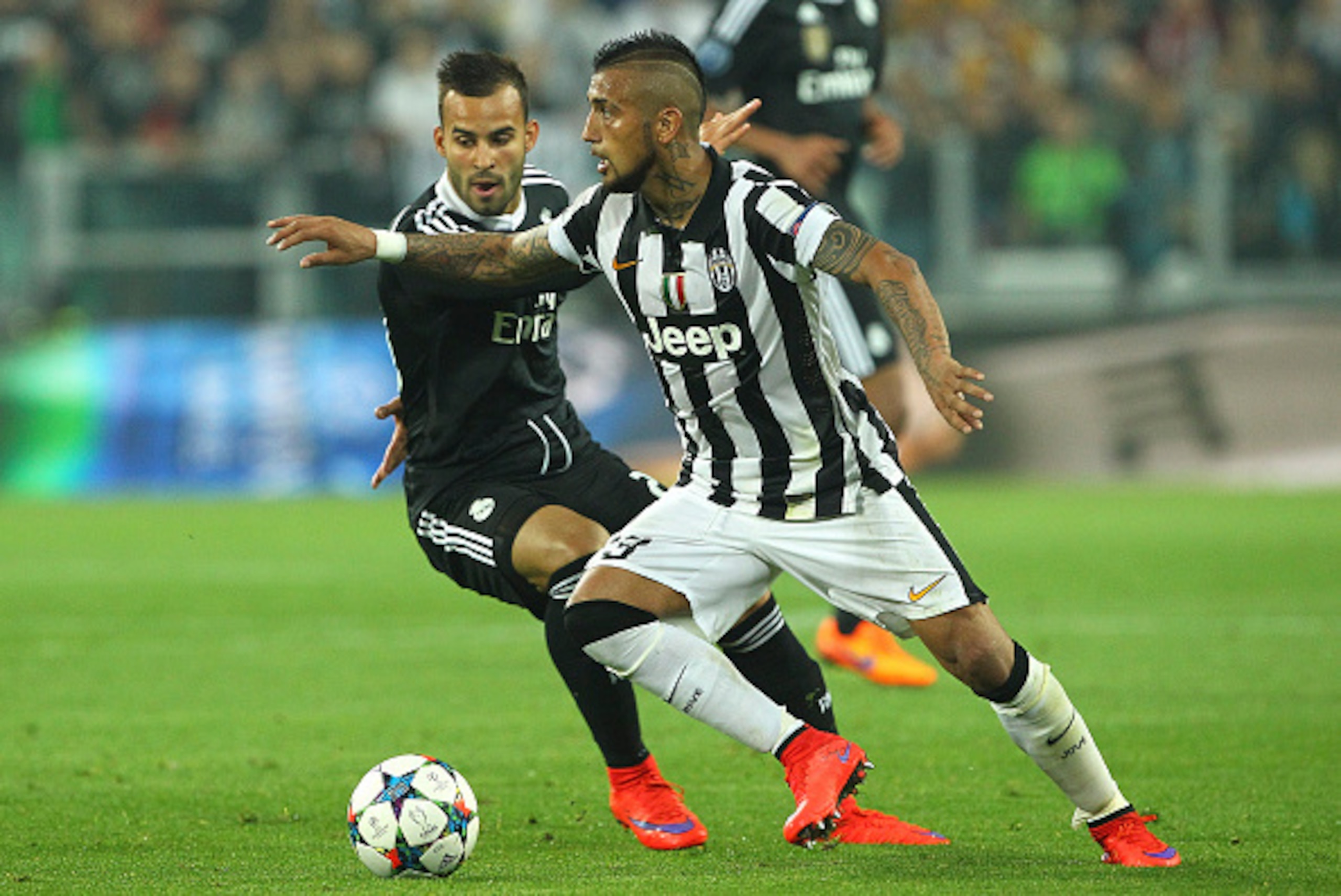 TURIN, ITALY - MAY 05:  Arturo Vidal (R) of Juventus FC competes for the ball with Jose (L) of Real Madrid CF during the UEFA Champions League semi final match between Juventus and Real Madrid CF at Juventus Arena on May 5, 2015 in Turin, Italy.  (Photo b
