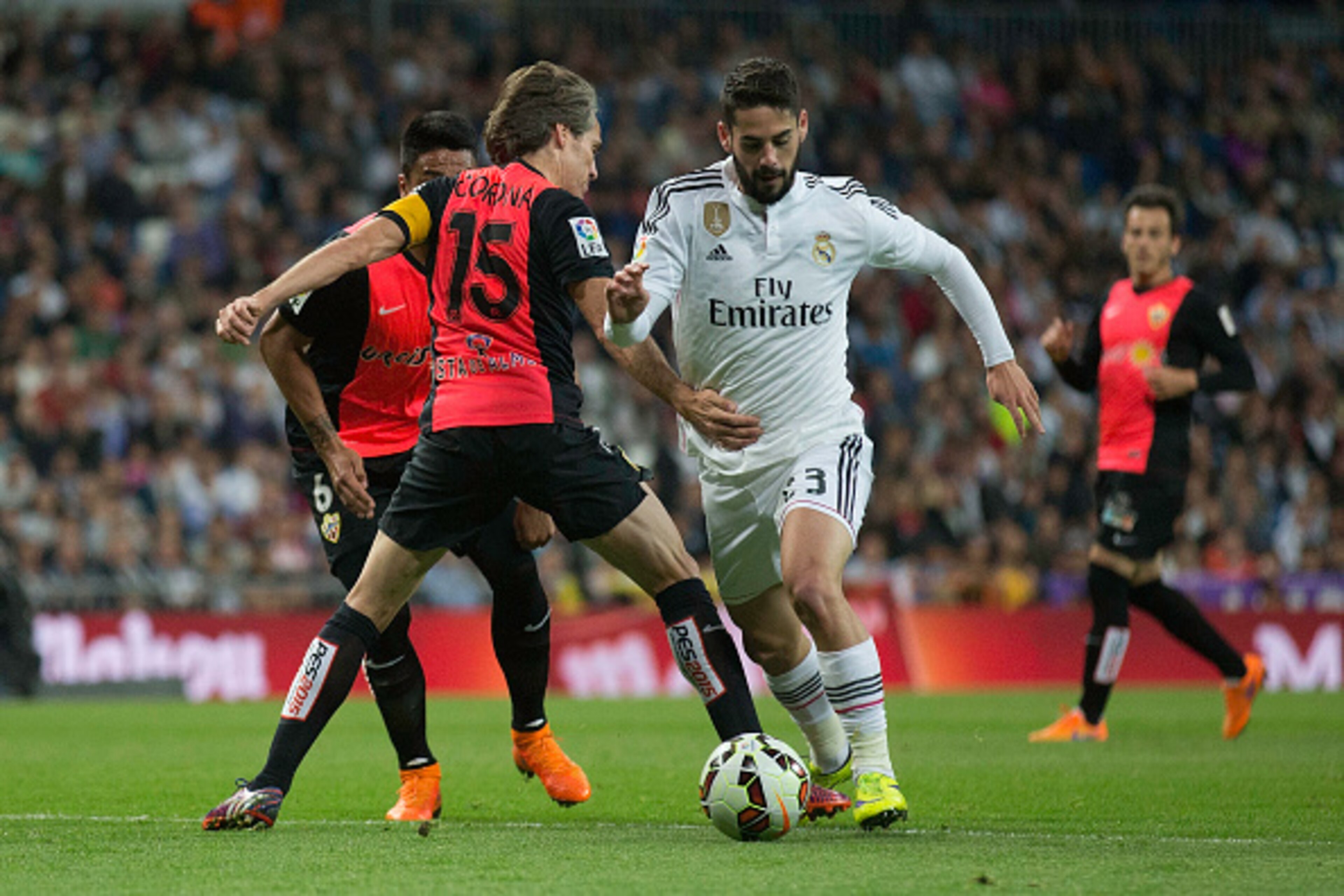 MADRID, SPAIN - APRIL 29: Francisco Roman Alarcon alias Isco (R) of Real Madrid CF competes for the ball with Miguel Angel Garcia Perez-Roldan alias Corona (L) of Almeria UD during the La Liga match between Real Madrid CF and UD Almeria at Estadio Santiag MADRID, SPAIN - APRIL 29: Francisco Roman Alarcon alias Isco (R) of Real Madrid CF competes for the ball with Miguel Angel Garcia Perez-Roldan alias Corona (L) of Almeria UD during the La Liga match between Real Madrid CF and UD Almeria at Estadio Santiag