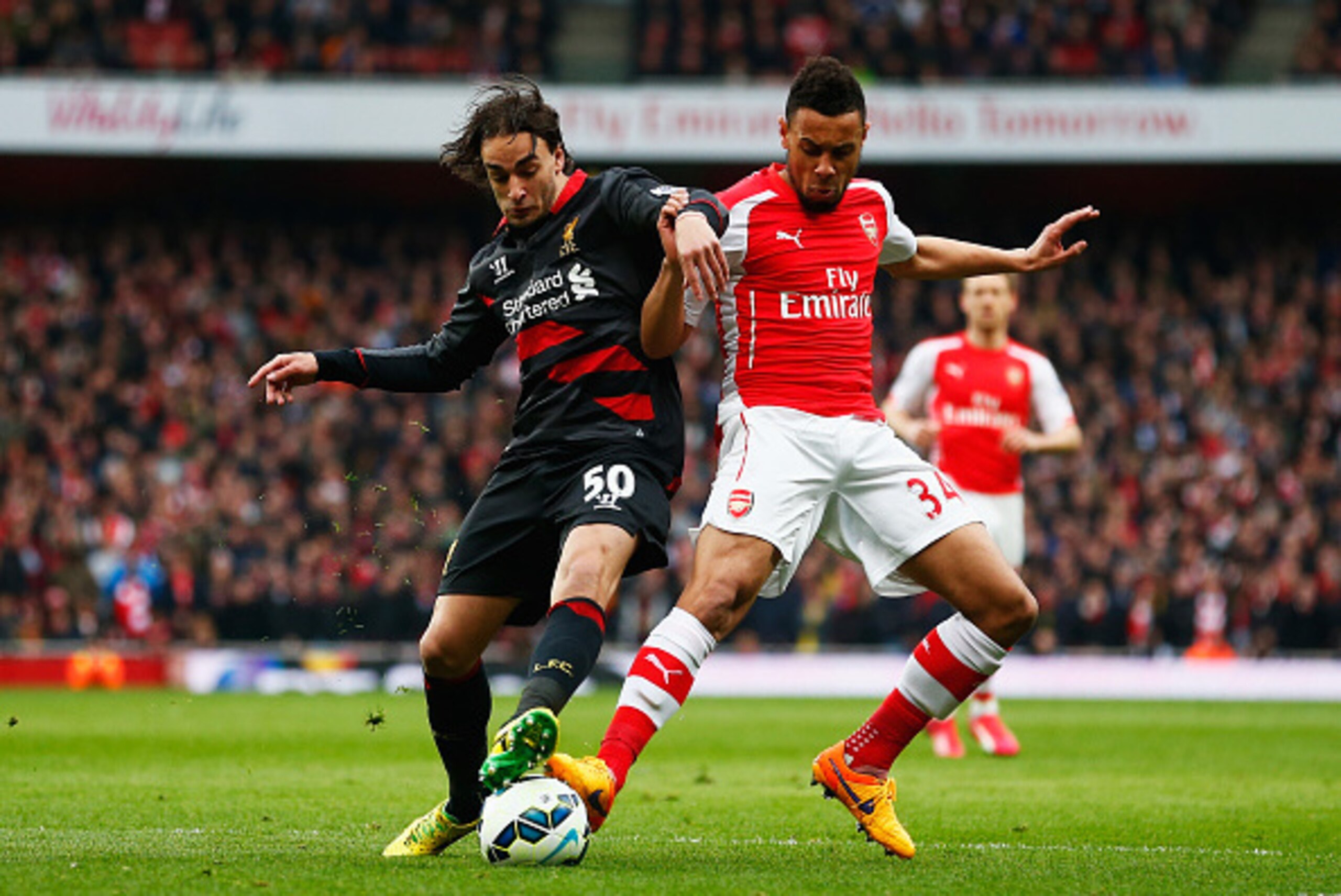LONDON, ENGLAND - APRIL 04:  Francis Coquelin of Arsenal battles for the ball with Lazar Markovic of Liverpool during the Barclays Premier League match between Arsenal and Liverpool at Emirates Stadium on April 4, 2015 in London, England.  (Photo by Julia