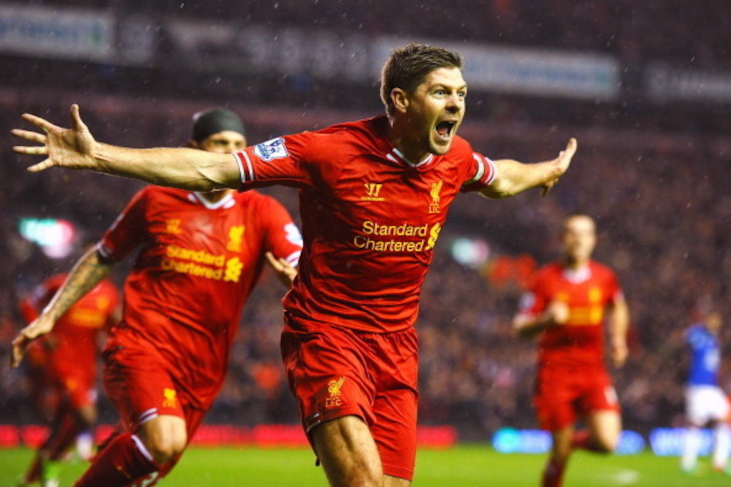 LIVERPOOL, ENGLAND - JANUARY 28:  Steven Gerrard of Liverpool celebrates after scoring the opening goal during the Barclays Premier League match between Liverpool and Everton at Anfield on January 28, 2014 in Liverpool, England.  (Photo by Laurence Griffi
