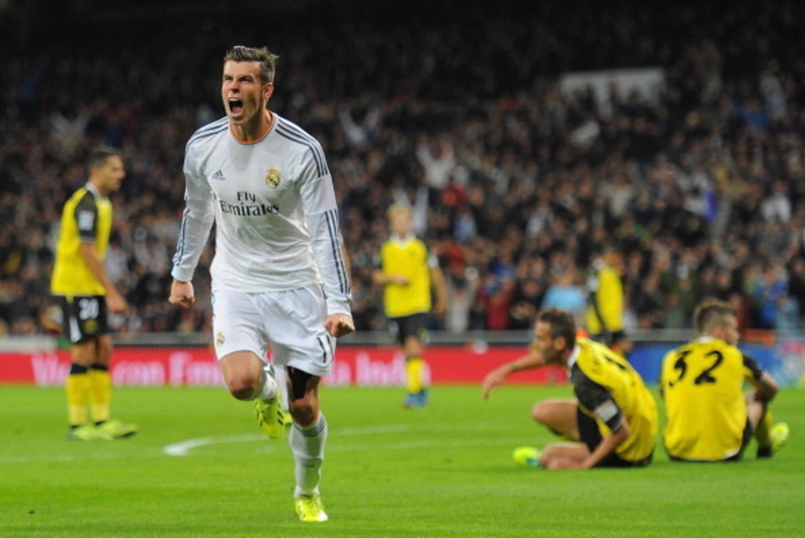 MADRID, SPAIN - OCTOBER 30:  Gareth Bale of Real Madrid CF celebrates after scoring Real's opening goal during the La Liga match between Real Madrid CF and Sevilla FC at the Santiago Bernabeu Stadium on October 30, 2013 in Madrid, Spain.  (Photo by Denis 