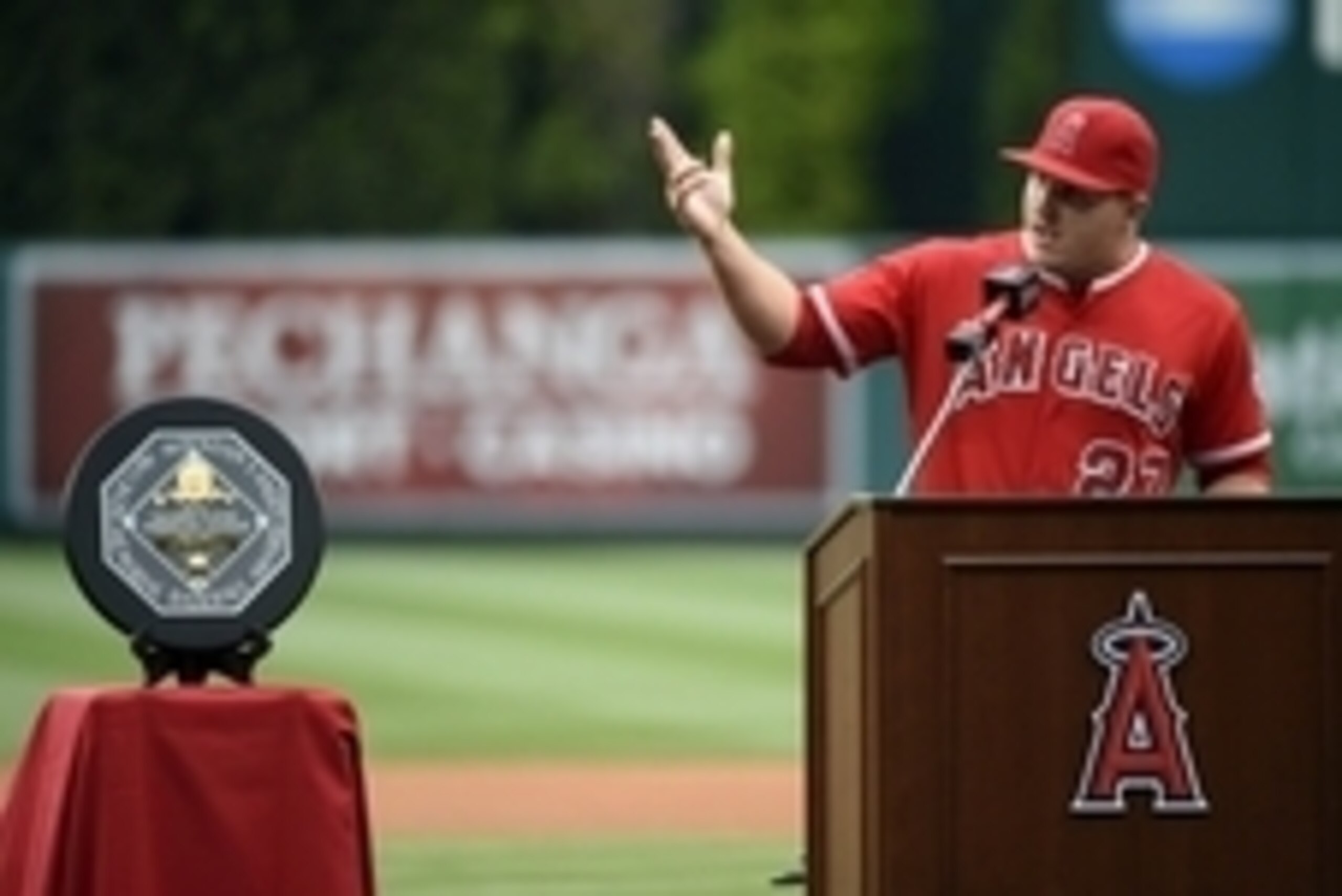 Apr 25, 2015; Anaheim, CA, USA; Los Angeles Angels center fielder Mike Trout speaks to the crowd after receiving his 2014 MVP award before the game against the Texas Rangers at Angel Stadium of Anaheim. Mandatory Credit: Richard Mackson-USA TODAY Sports