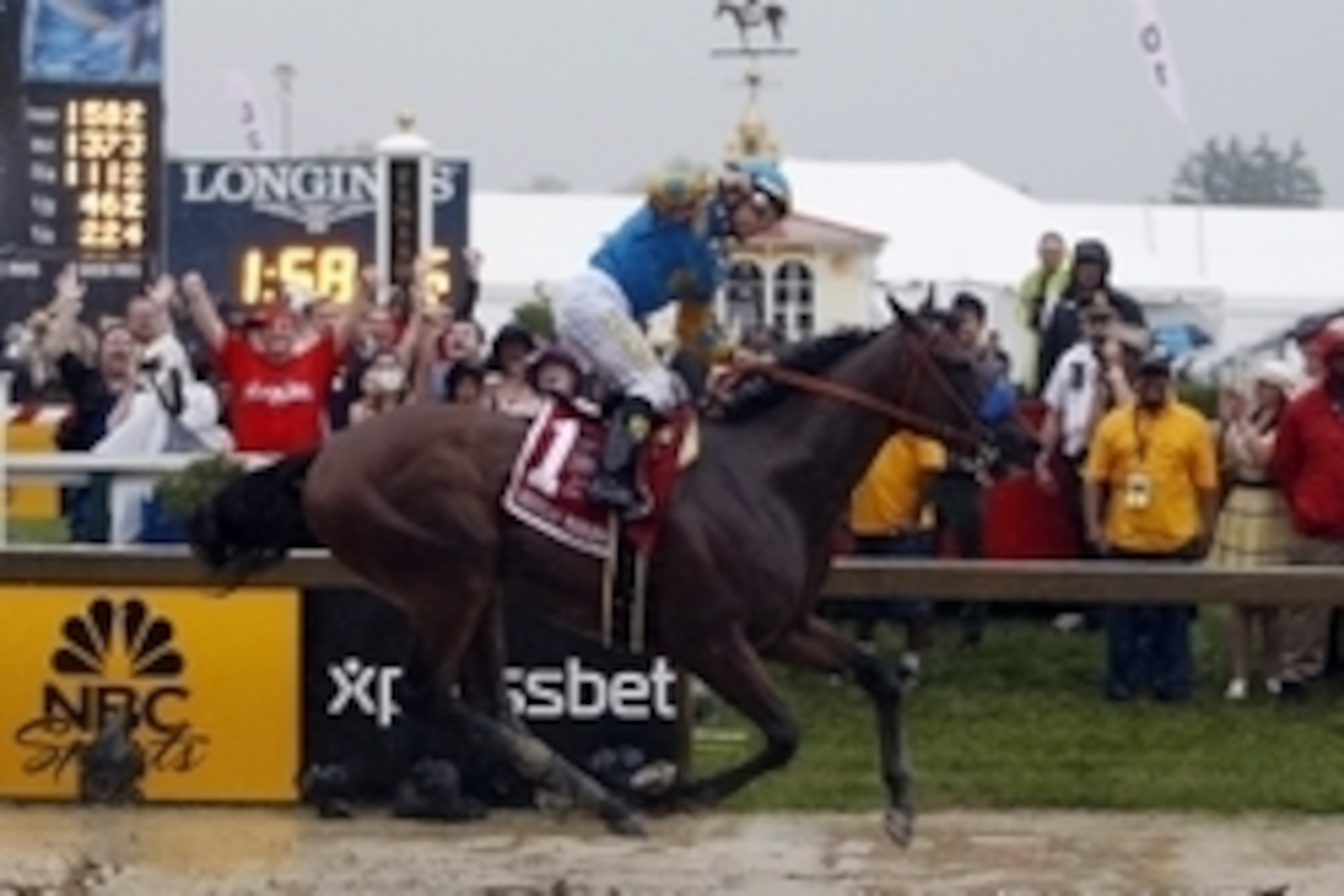 May 16, 2015; Baltimore, MD, USA; Victor Espinoza aboard American Pharoah celebrates winning the 140th Preakness Stakes at Pimlico Race Course. Mandatory Credit: Peter Casey-USA TODAY Sports