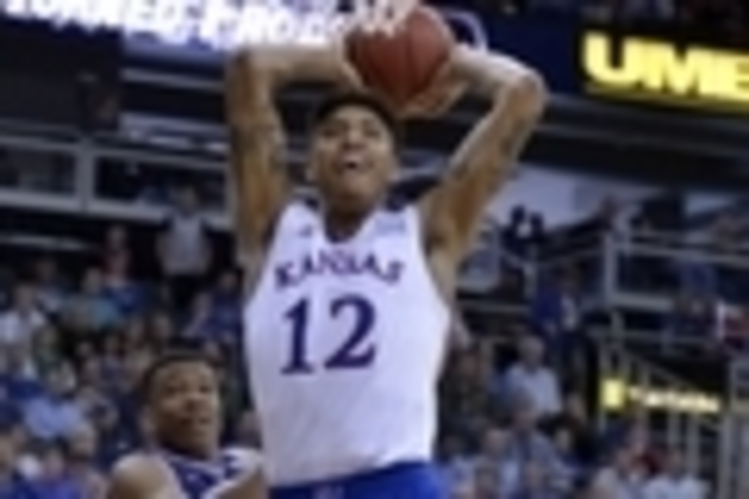 Mar 12, 2015; Kansas City, MO, USA; Kansas Jayhawks guard Kelly Oubre Jr. (12) dunks the ball as TCU Horned Frogs forward Brandon Parrish (11) tries to defend during the first round at Sprint Center. Kansas won 64-59. Mandatory Credit: Denny Medley-USA TO Mar 12, 2015; Kansas City, MO, USA; Kansas Jayhawks guard Kelly Oubre Jr. (12) dunks the ball as TCU Horned Frogs forward Brandon Parrish (11) tries to defend during the first round at Sprint Center. Kansas won 64-59. Mandatory Credit: Denny Medley-USA TO