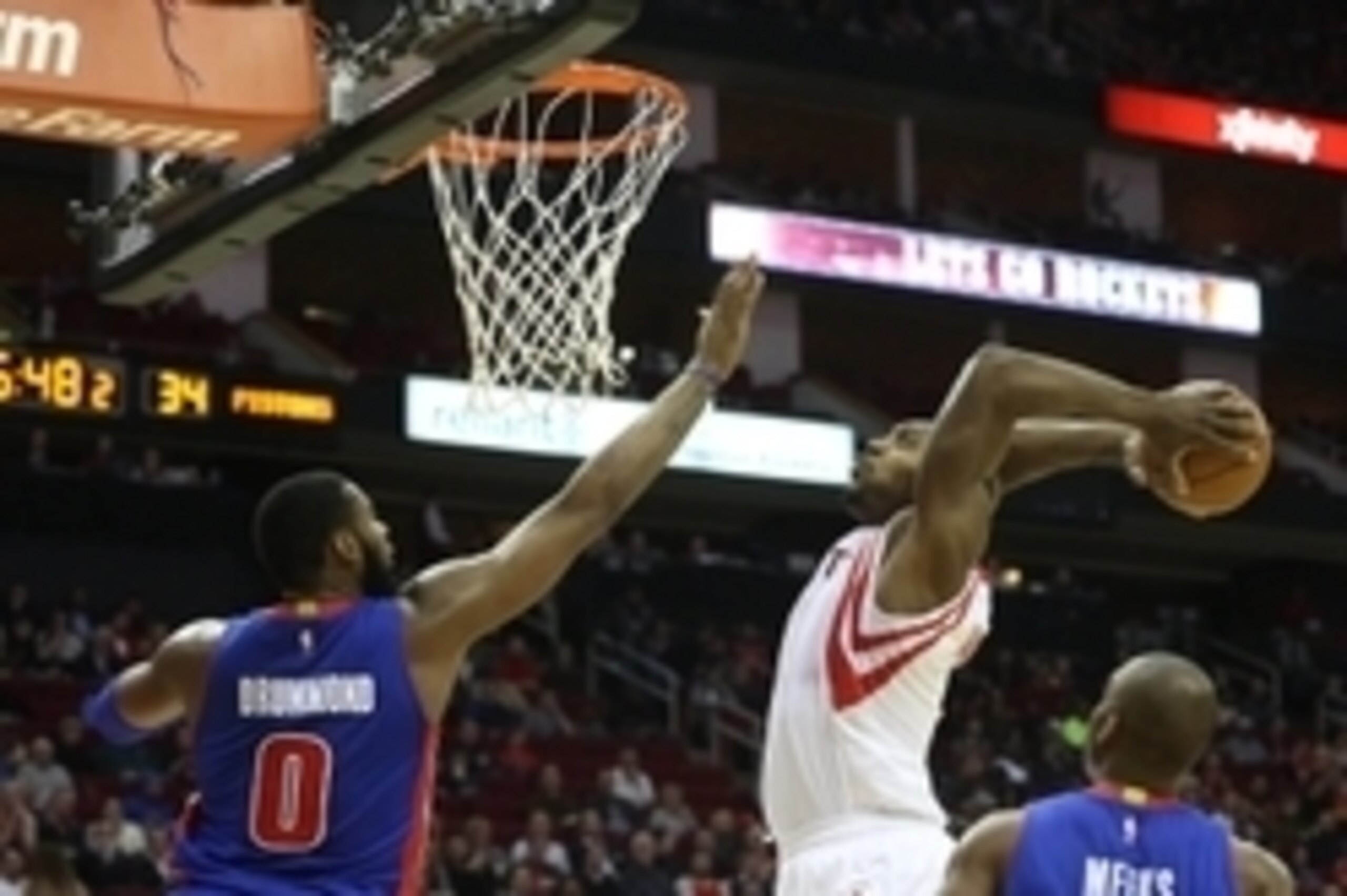 Mar 6, 2015; Houston, TX, USA; Houston Rockets center Joey Dorsey (8) dunks the ball in front of Detroit Pistons center Andre Drummond (0) in the first half at Toyota Center. Mandatory Credit: Thomas B. Shea-USA TODAY Sports