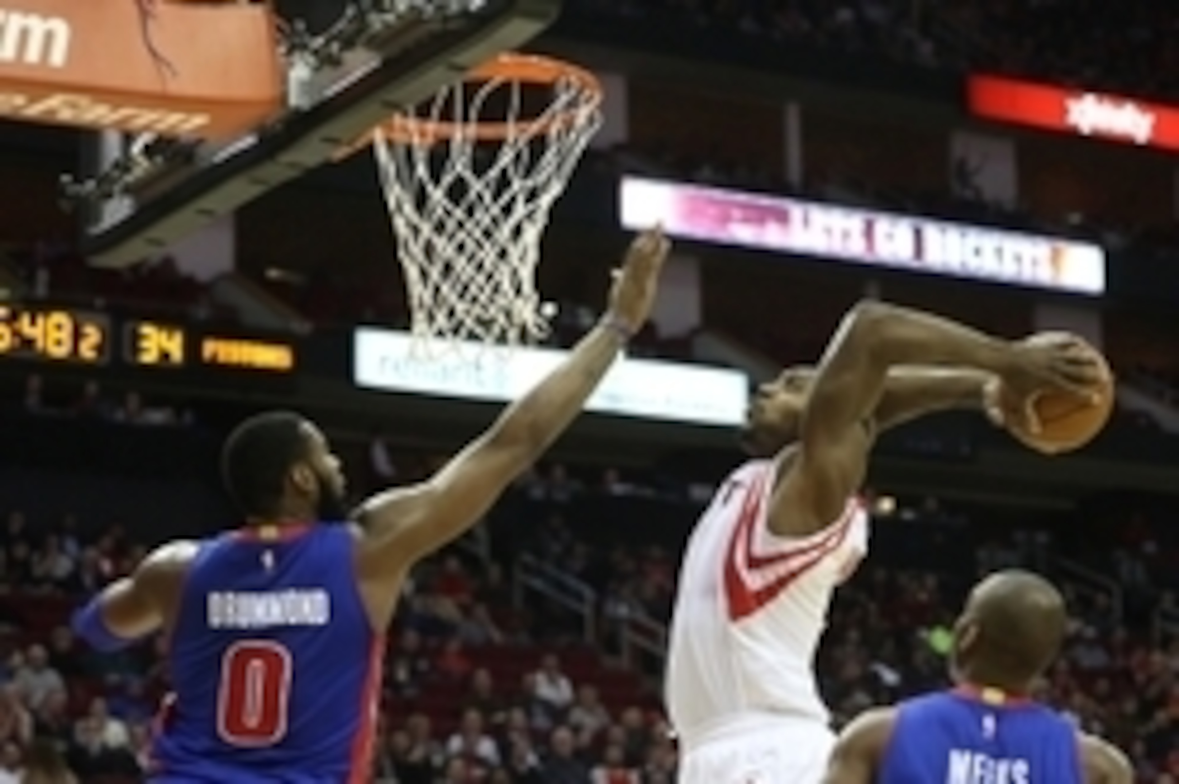 Mar 6, 2015; Houston, TX, USA; Houston Rockets center Joey Dorsey (8) dunks the ball in front of Detroit Pistons center Andre Drummond (0) in the first half at Toyota Center. Mandatory Credit: Thomas B. Shea-USA TODAY Sports