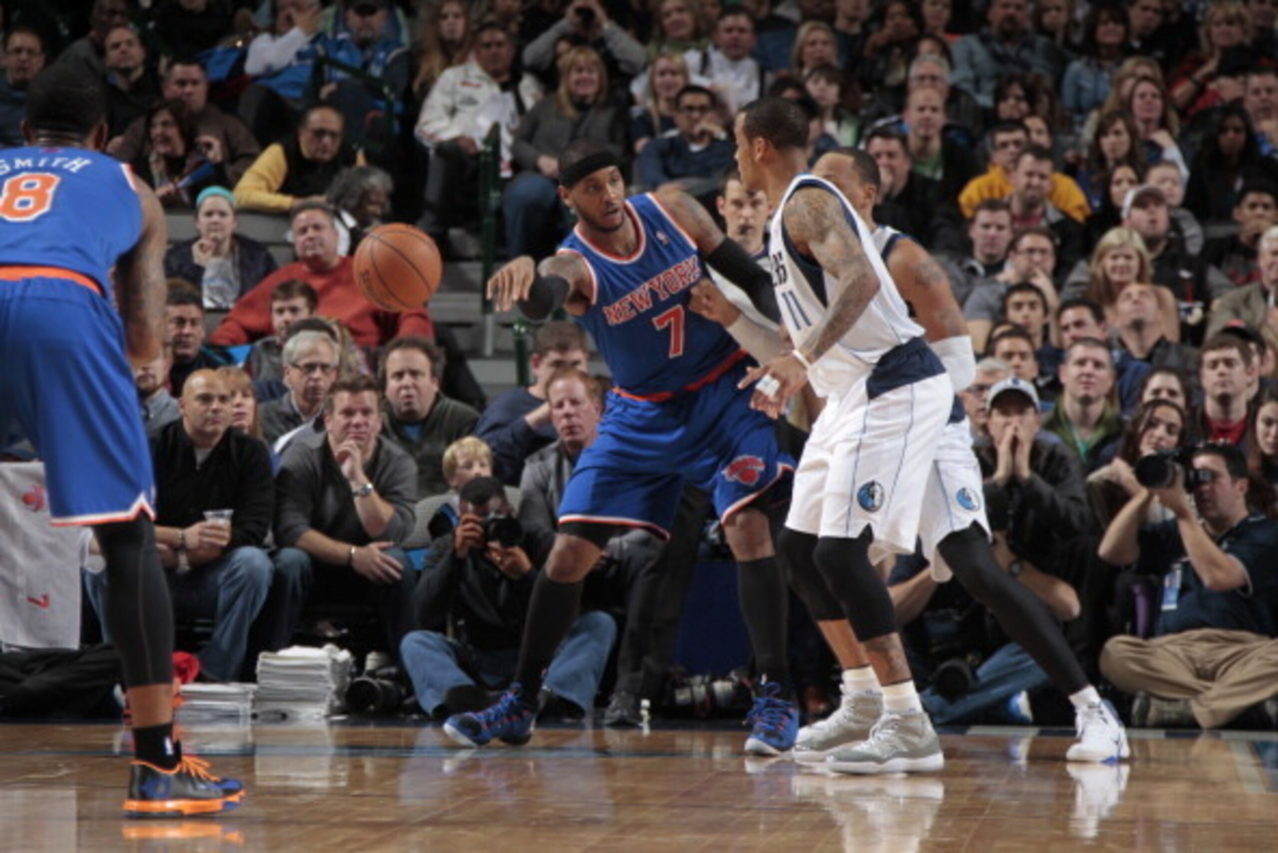 DALLAS, TX - JANUARY 5: Carmelo Anthony #7 of the New York Knicks passes the ball to J.R. Smith #8 against Monta Ellis #11 of the Dallas Mavericks on January 5, 2014 at the American Airlines Center in Dallas, Texas. NOTE TO USER: User expressly acknowledg