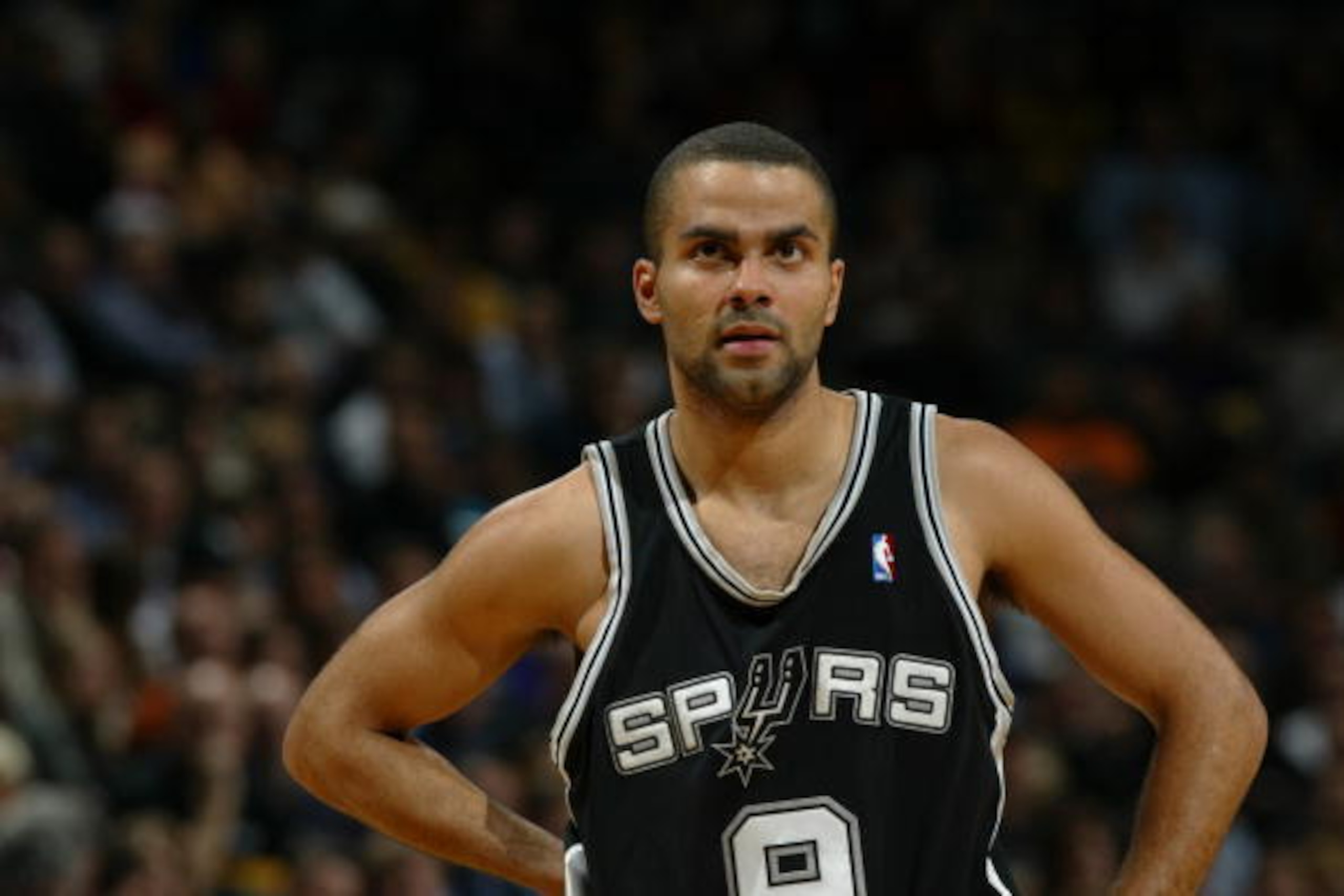 MILWAUKEE - DECEMBER 20:  Tony Parker #9 of the San Antonio Spurs stands on the court during the game against the Milwaukee Bucks on December 20, 2005 at the Bradley Center in Milwaukee, Wisconsin. The Bucks won 109-107 in overtime. NOTE TO USER: User exp
