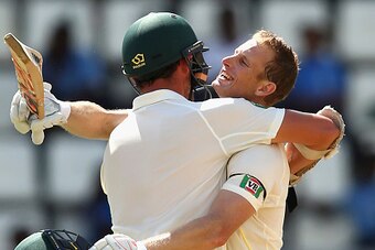 ROSEAU, DOMINICA - JUNE 04:  Adam Voges of Australia celebrates with Josh Hazlewood of Australia after Voges reached his maiden century in his debut test during day two of the First Test match between Australia and the West Indies at Windsor Park on June 