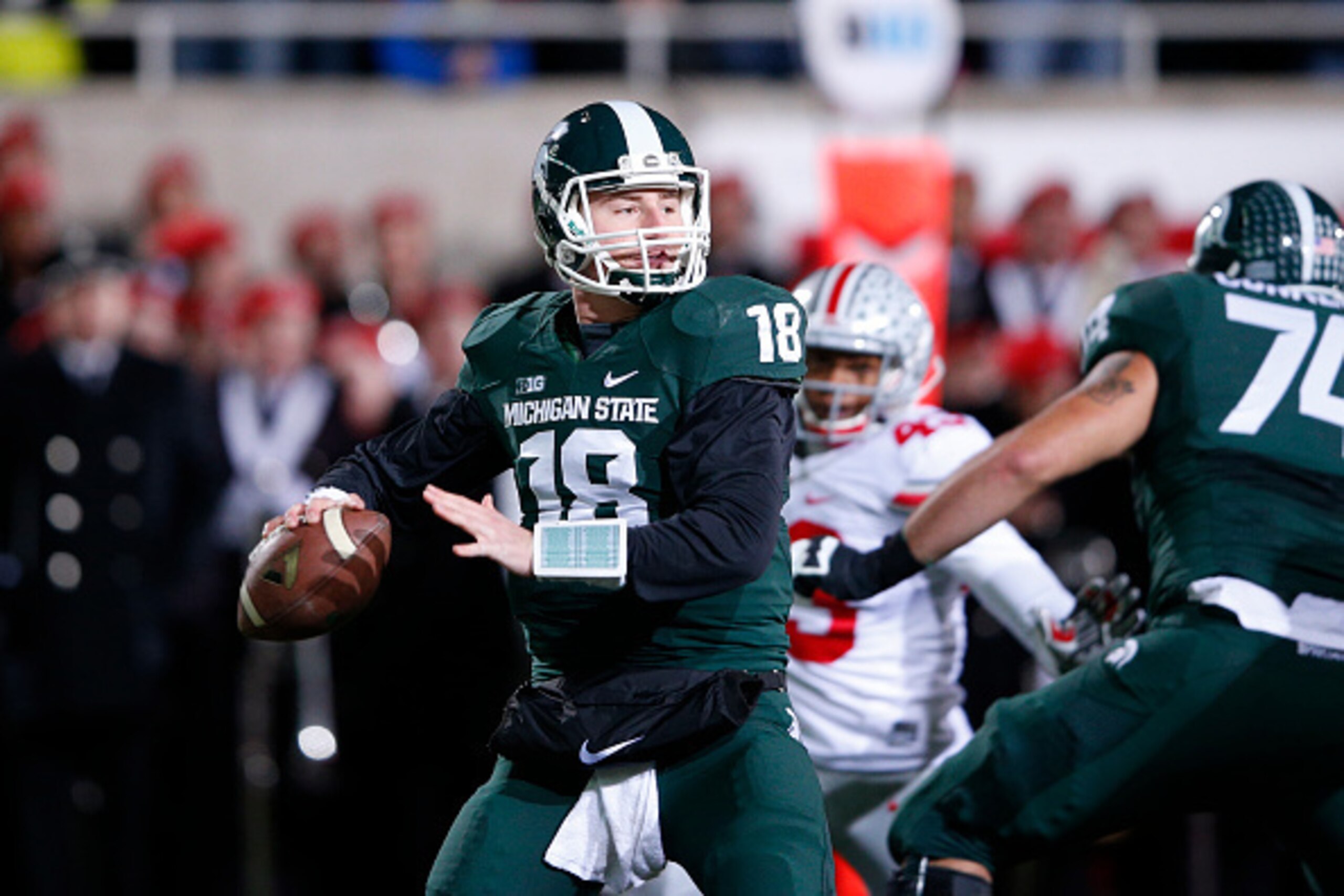 EAST LANSING, MI - NOVEMBER 8: Connor Cook #18 of the Michigan State Spartans looks to pass the ball in the first half of the game against the Ohio State Buckeyes at Spartan Stadium on November 8, 2014 in East Lansing, Michigan. (Photo by Joe Robbins/Gett