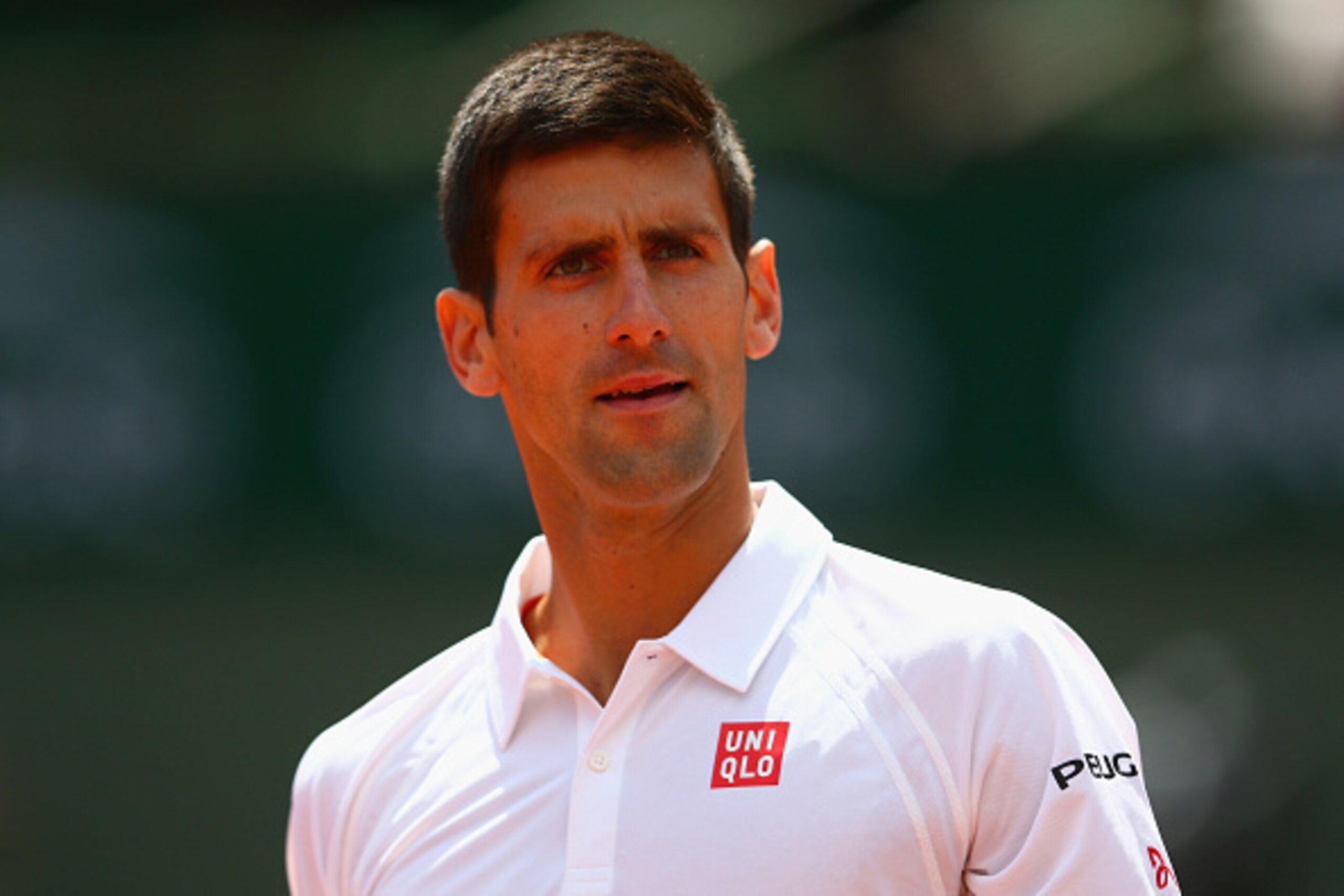 PARIS, FRANCE - MAY 30:  Novak Djokovic of Serbia looks on in his Men's Singles match against Thanasi Kokkinakis of Australia on day seven of the 2015 French Open at Roland Garros on May 30, 2015 in Paris, France.  (Photo by Clive Mason/Getty Images)