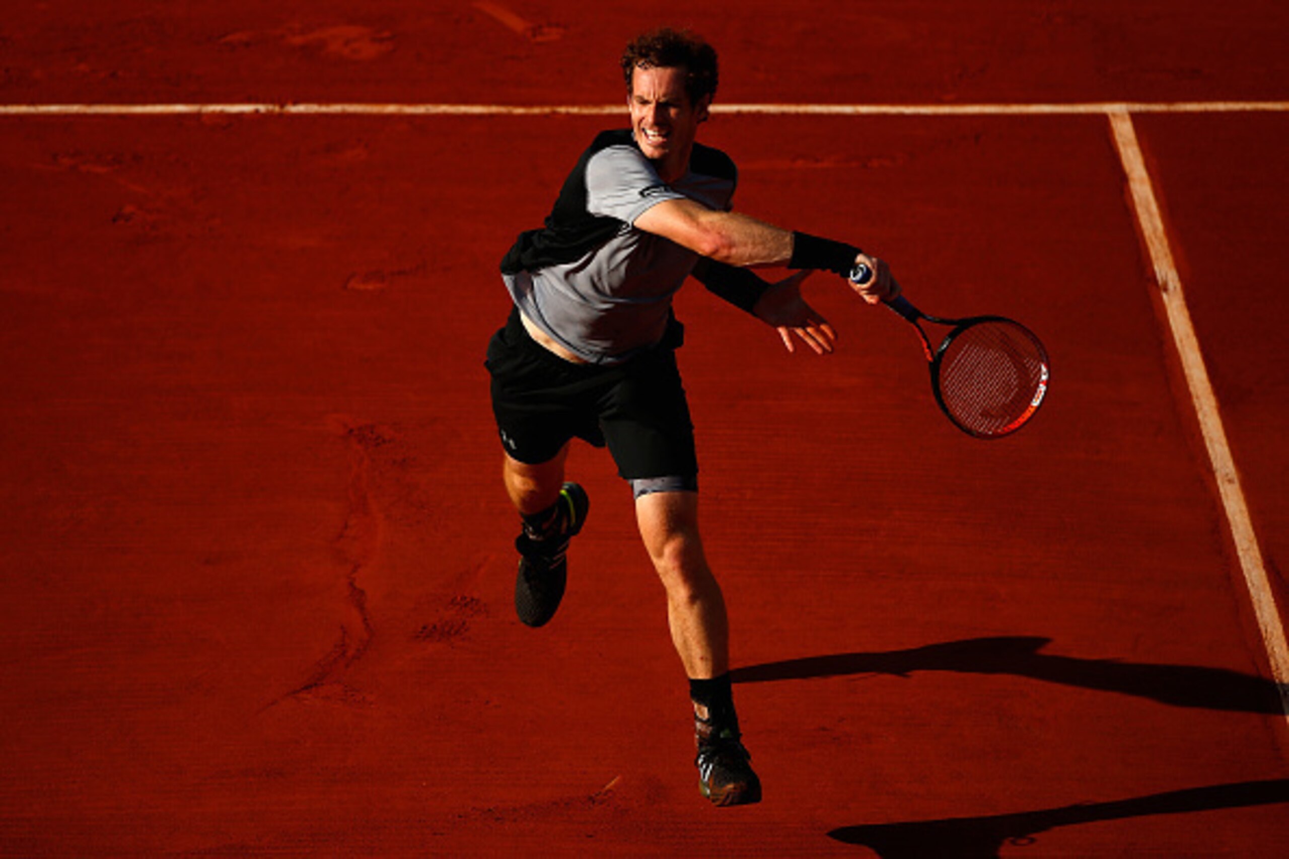 PARIS, FRANCE - JUNE 03:  Andy Murray of Great Britain returns a shot in his Men's quarter final match against David Ferrer of Spain on day eleven of the 2015 French Open at Roland Garros on June 3, 2015 in Paris, France.  (Photo by Julian Finney/Getty Im