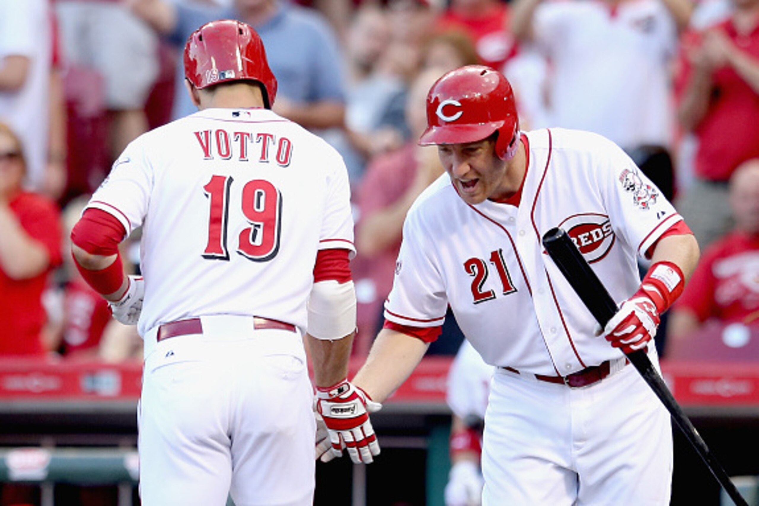 CINCINNATI, OH - MAY 29:  Joey Votto #19 of the Cincinnati Reds celebrates with Todd Frazier after Votto hits a homerun in the 1st inning during the game against the Washington Nationals at Great American Ball Park on May 29, 2015 in Cincinnati, Ohio.  (P
