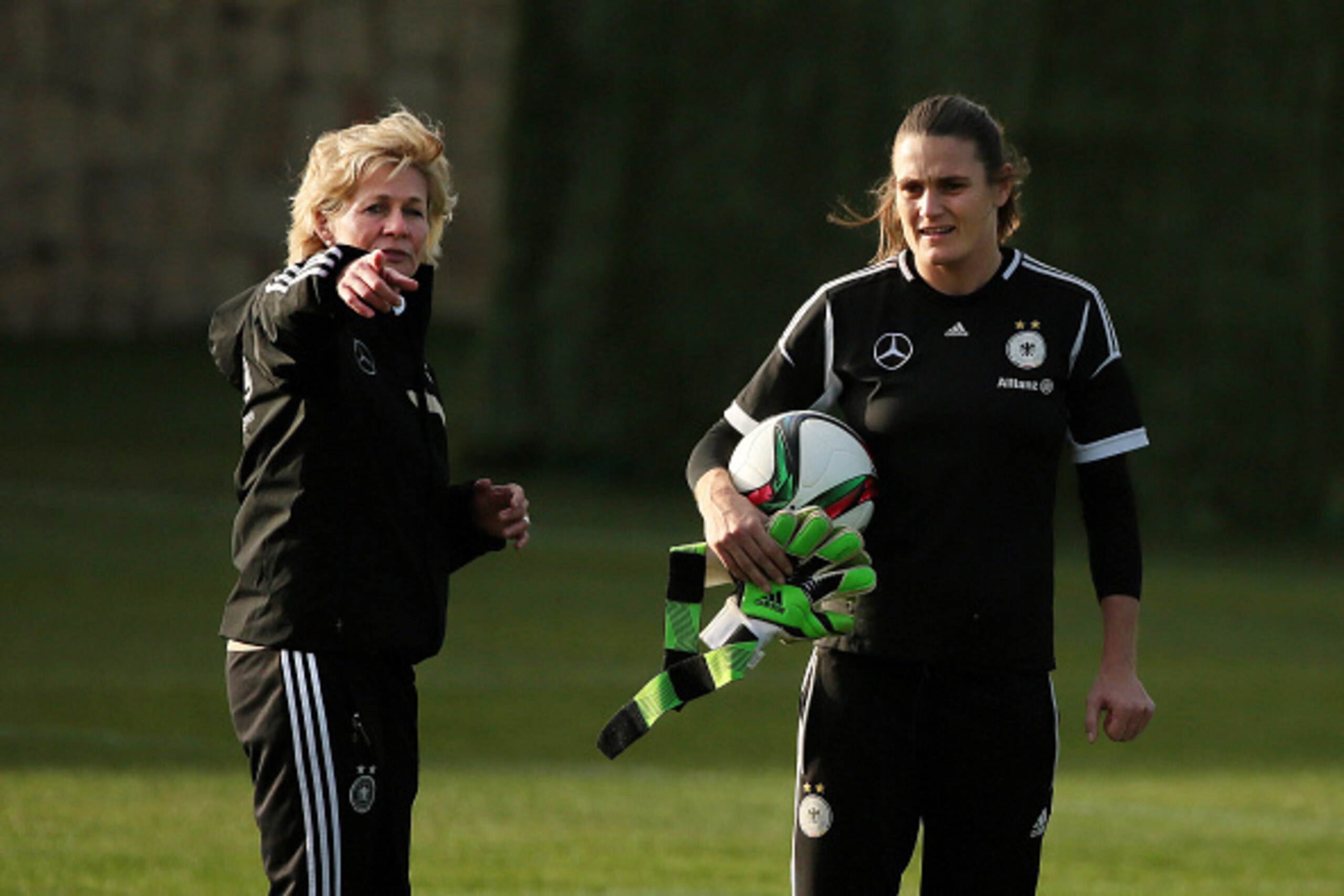 MARBELLA, SPAIN - FEBRUARY 09:  Head coach Silvia Neid talks with goalkeeper Nadine Angerer during a Germany Women's Training Session at Marbella Football Center on February 9, 2015 in Marbella, Spain.  (Photo by Sergio Camacho/Getty Images)