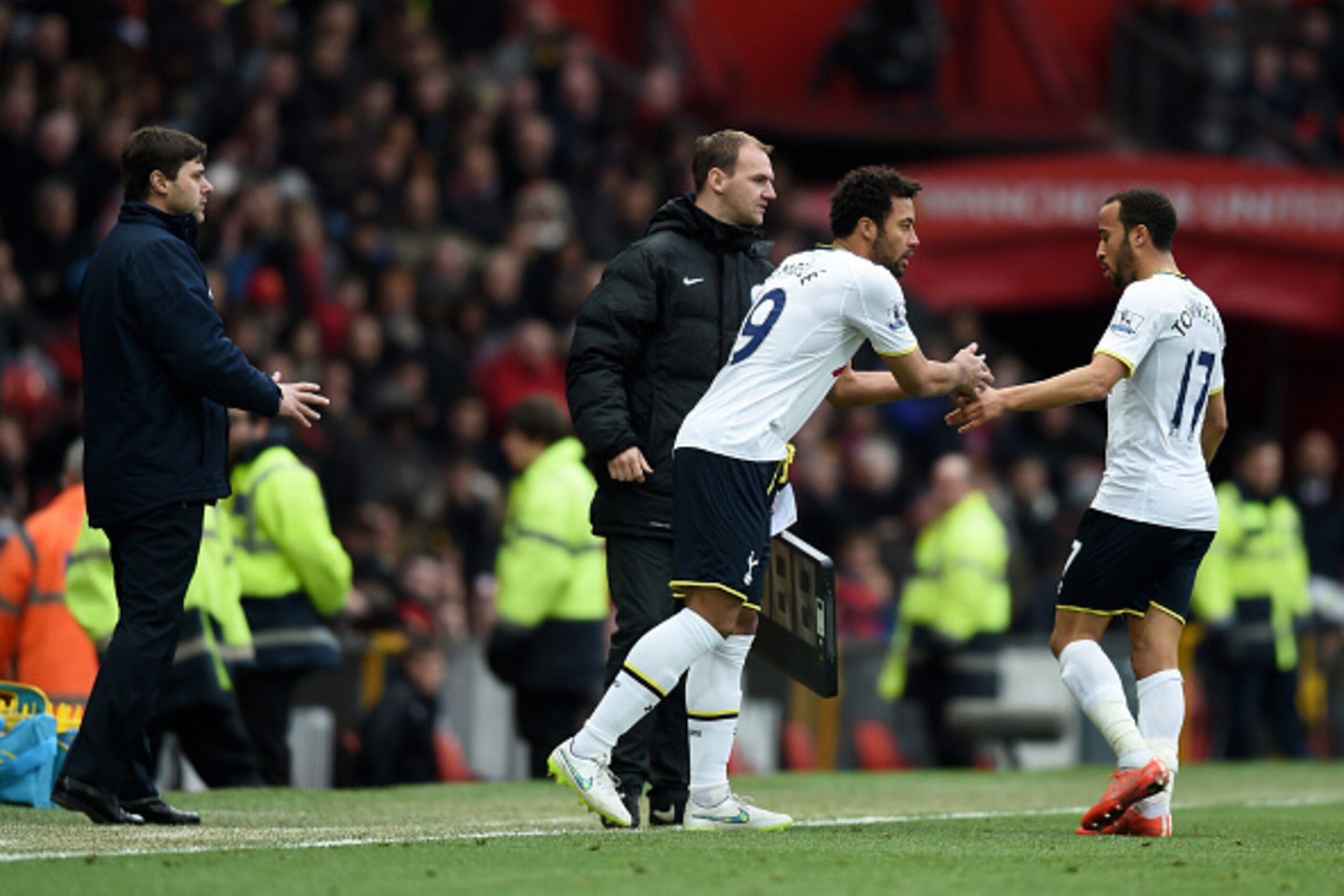 MANCHESTER, ENGLAND - MARCH 15:  Manager Mauricio Pochettino of Spurs sends on Mousa Dembele of Spurs as a first half substitute for the beleaguered Andros Townsend of Spurs  during the Barclays Premier League match between Manchester United and Tottenham