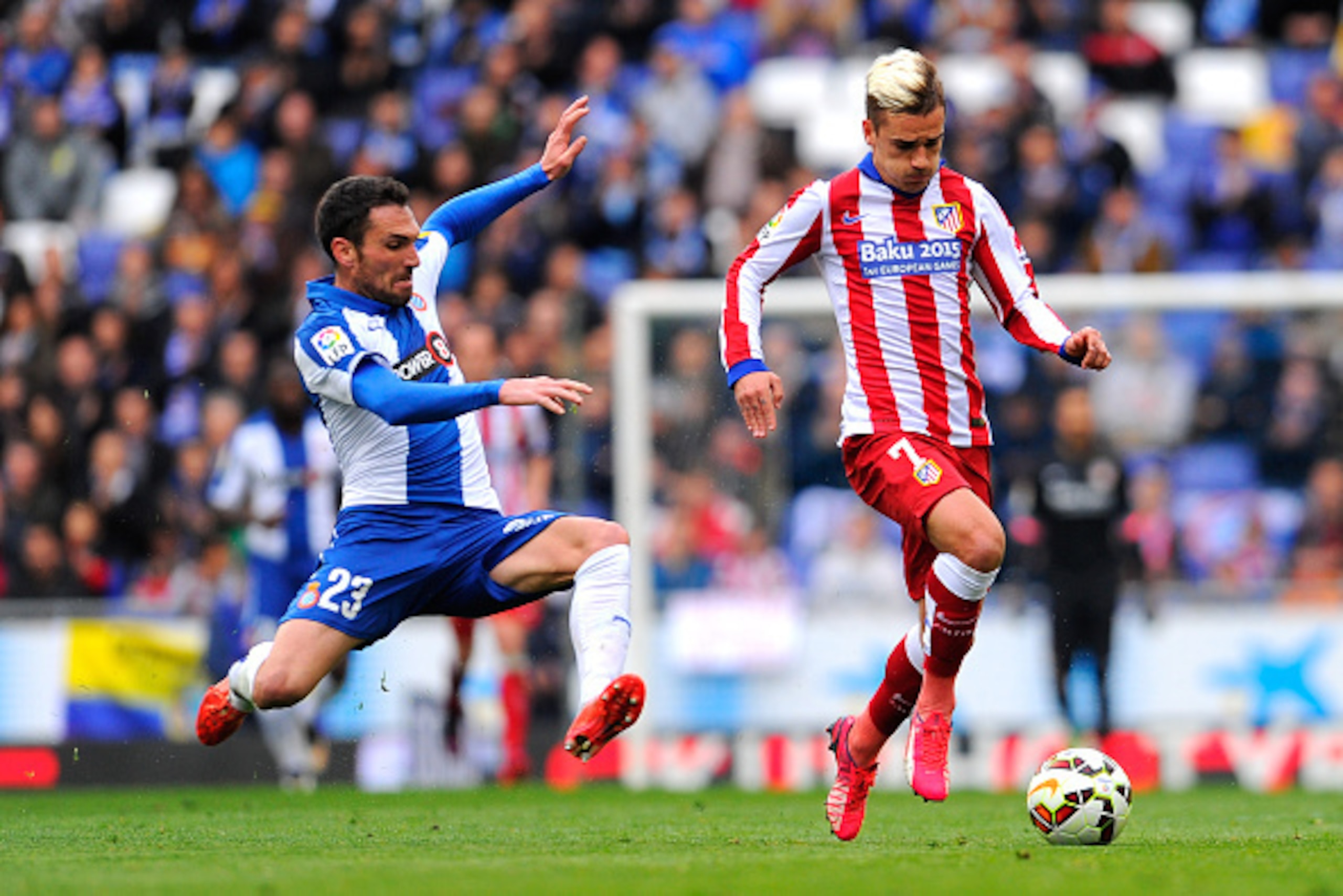 BARCELONA, SPAIN - MARCH 14:  Antoine Griezmann of Atletico de Madrid competes for the ball with Anaitz Arbilla of RCD Espanyol during the La Liga match between RCD Espanyol and Club Atletico de Madrid at Power 8 Stadium on March 14, 2015 in Barcelona, Sp