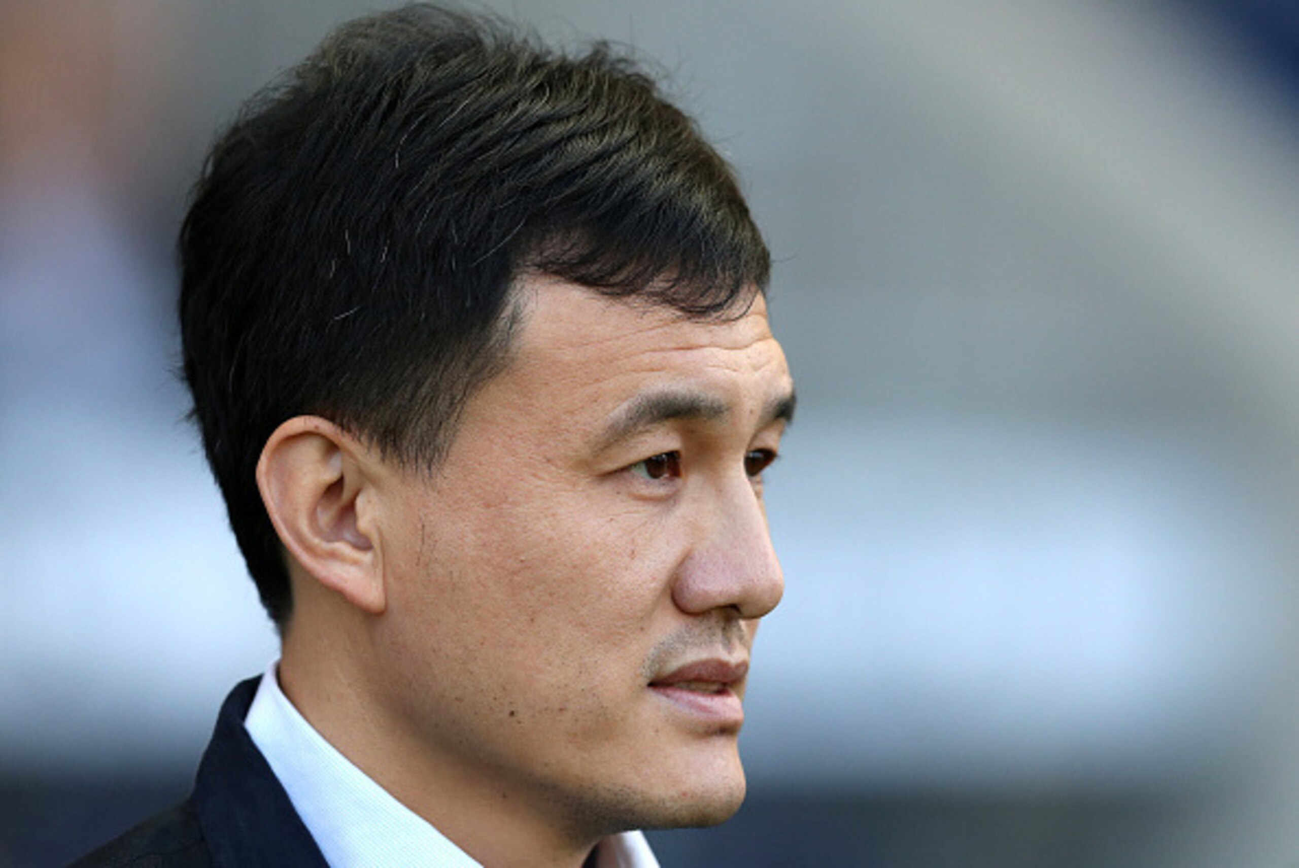 MANCHESTER, ENGLAND - APRIL 09: China coach Wei Hao looks on during the Women's Friendly International match between England and China at the Manchester City Academy Stadium on April 9, 2015 in Manchester, England. (Photo by Chris Brunskill/Getty Images)