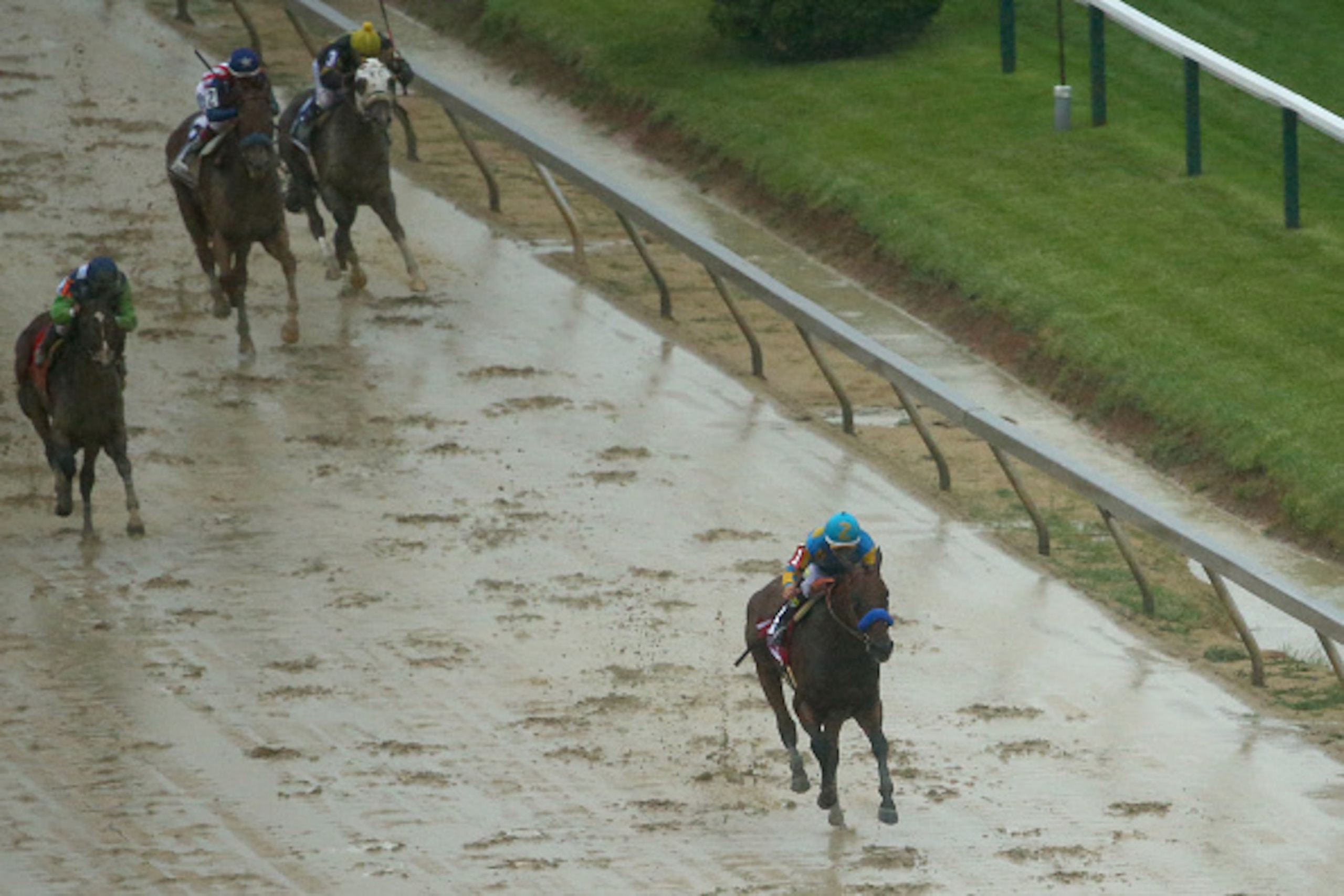 BALTIMORE, MD - MAY 16:  American Pharoah ridden by Victor Espinoza approaches the finish line to win the 140th running of the Preakness Stakes at Pimlico Race Course on May 16, 2015 in Baltimore, Maryland.  (Photo by Maddie Meyer/Getty Images)