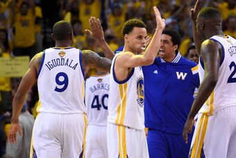 June 4, 2015; Oakland, CA, USA; Golden State Warriors guard Stephen Curry (30) celebrates a scoring play during a time out against the Cleveland Cavaliers in the overtime period in game one of the NBA Finals. at Oracle Arena. Mandatory Credit: Kyle Terada