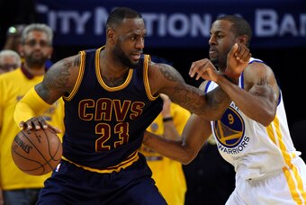 Jun 4, 2015; Oakland, CA, USA; Cleveland Cavaliers forward LeBron James (23) drives to the basket against Golden State Warriors guard Andre Iguodala (9) during the fourth quarter in game one of the NBA Finals at Oracle Arena. Mandatory Credit: Kyle Terada