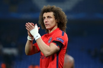 LONDON, ENGLAND - MARCH 11: David Luiz of PSG applauds the fans following his teams victory following extra time during the UEFA Champions League Round of 16, second leg match between Chelsea and Paris Saint-Germain at Stamford Bridge on March 11, 2015 in